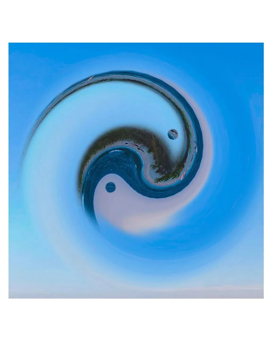 Swirling water in a pool creating a vortex effect, with a blue sky reflected on the surface