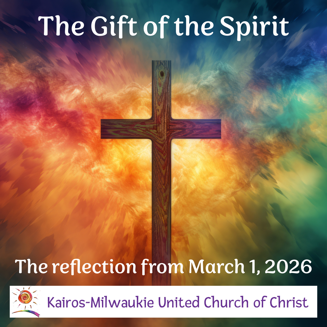 Wooden cross on a smoky, rainbow background.