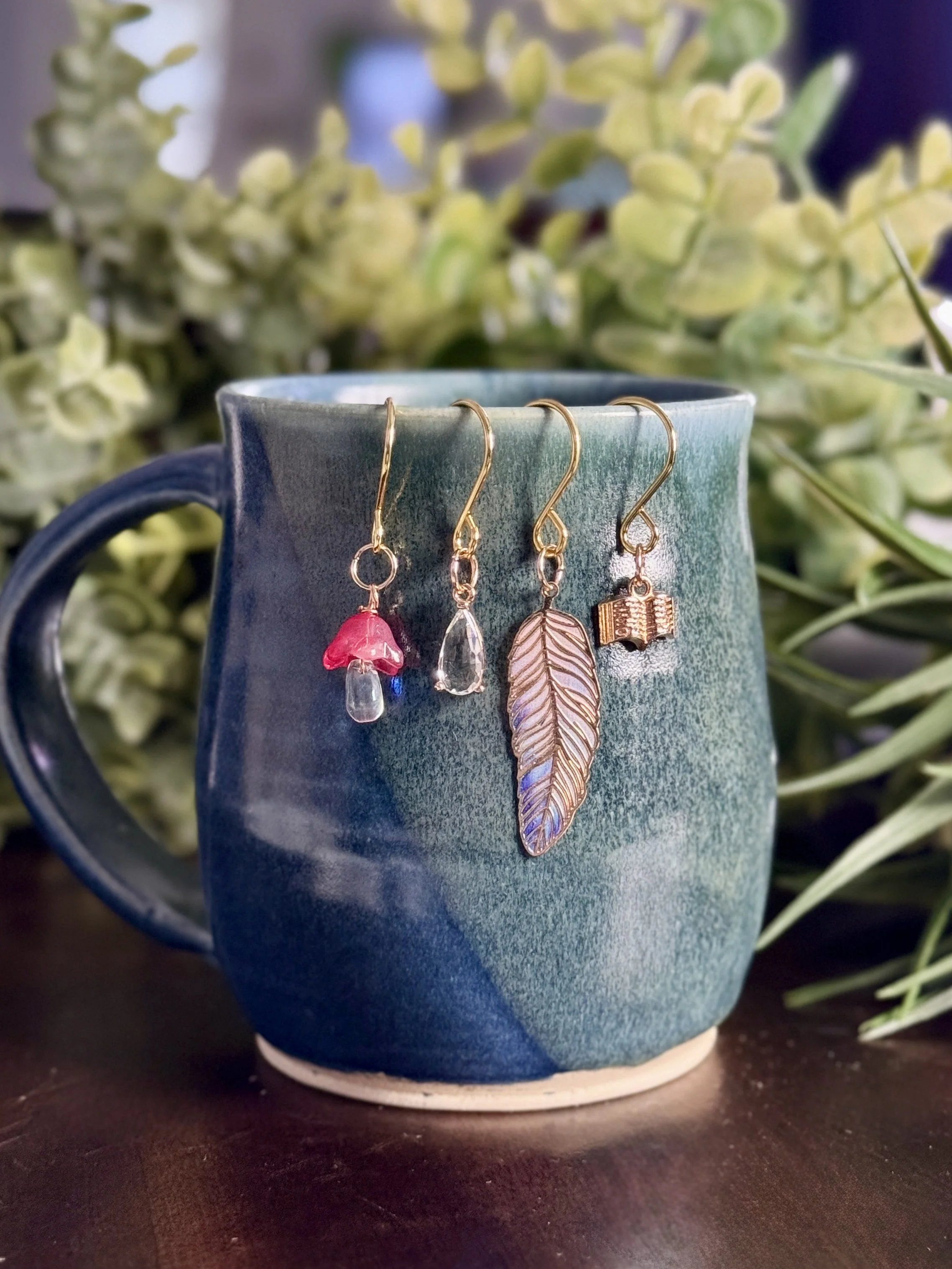 front veiw pink mushroom + book + feather + crystal plant charms