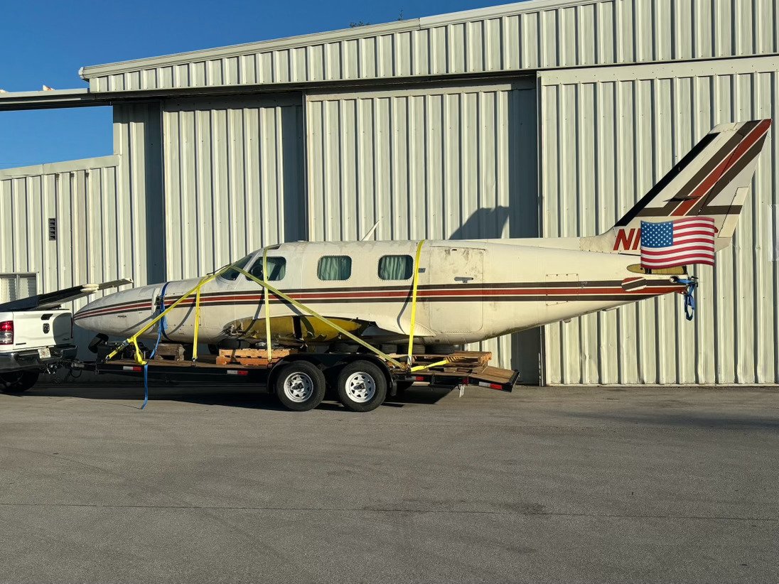 Car Hauler Carrying Plane