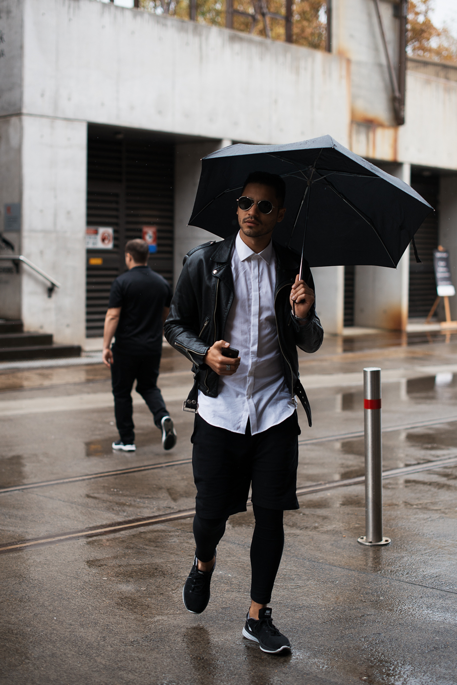 Under the umbrella.