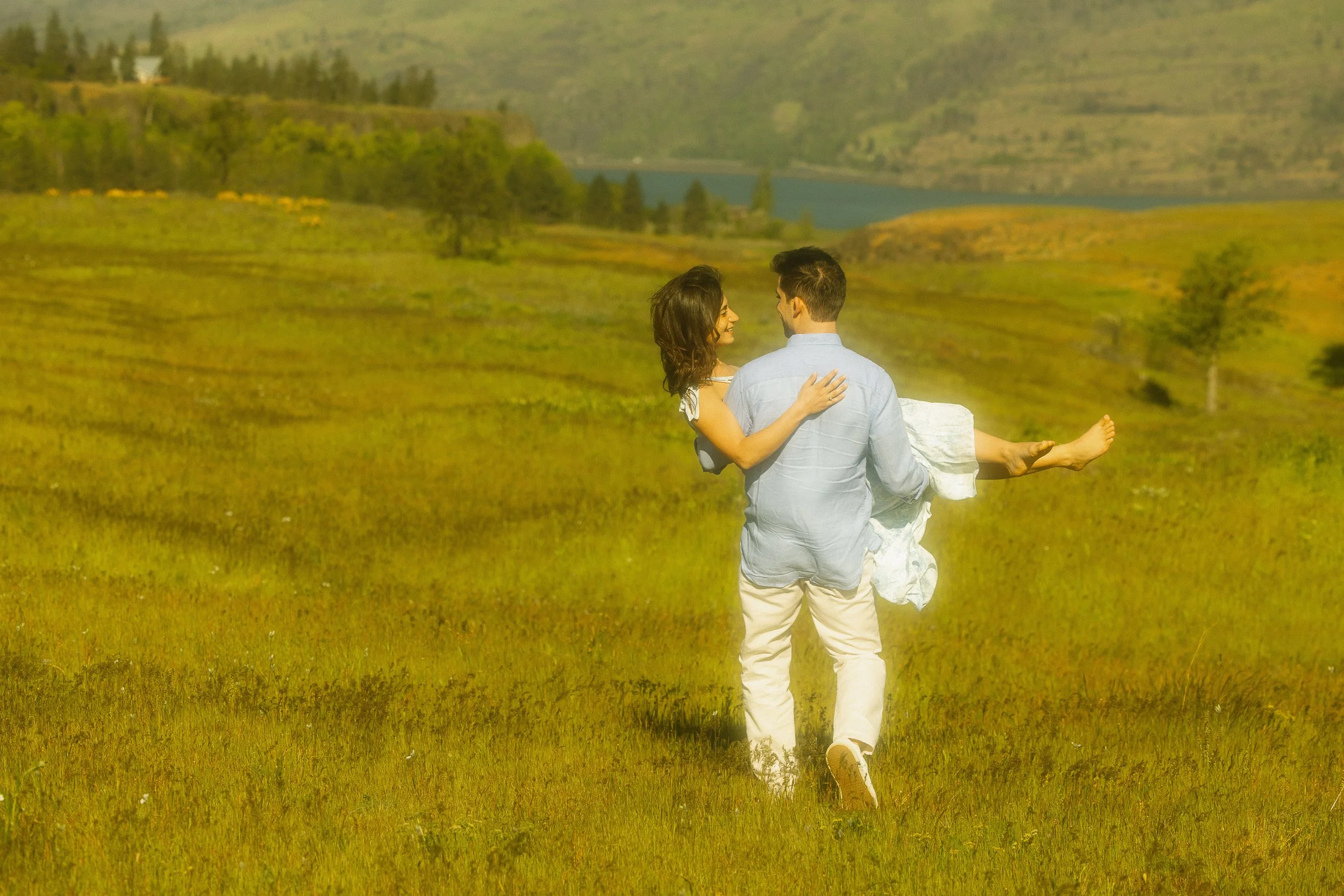 Couple at Rowena Crest viewpoint with spring wildflowers Oregon