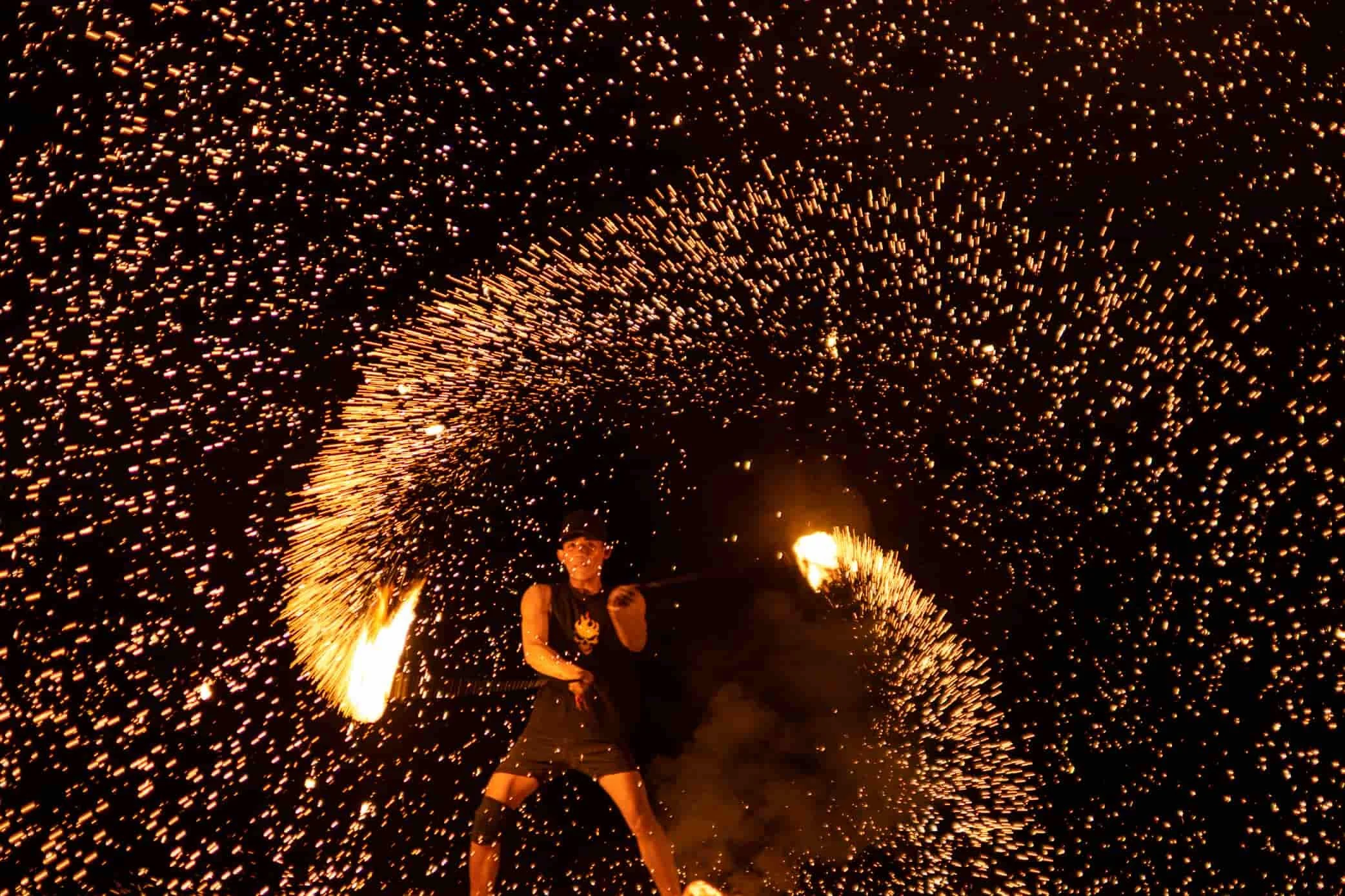 fire show at kalut cafe Langkawi, performer is turning fire with sparks effect