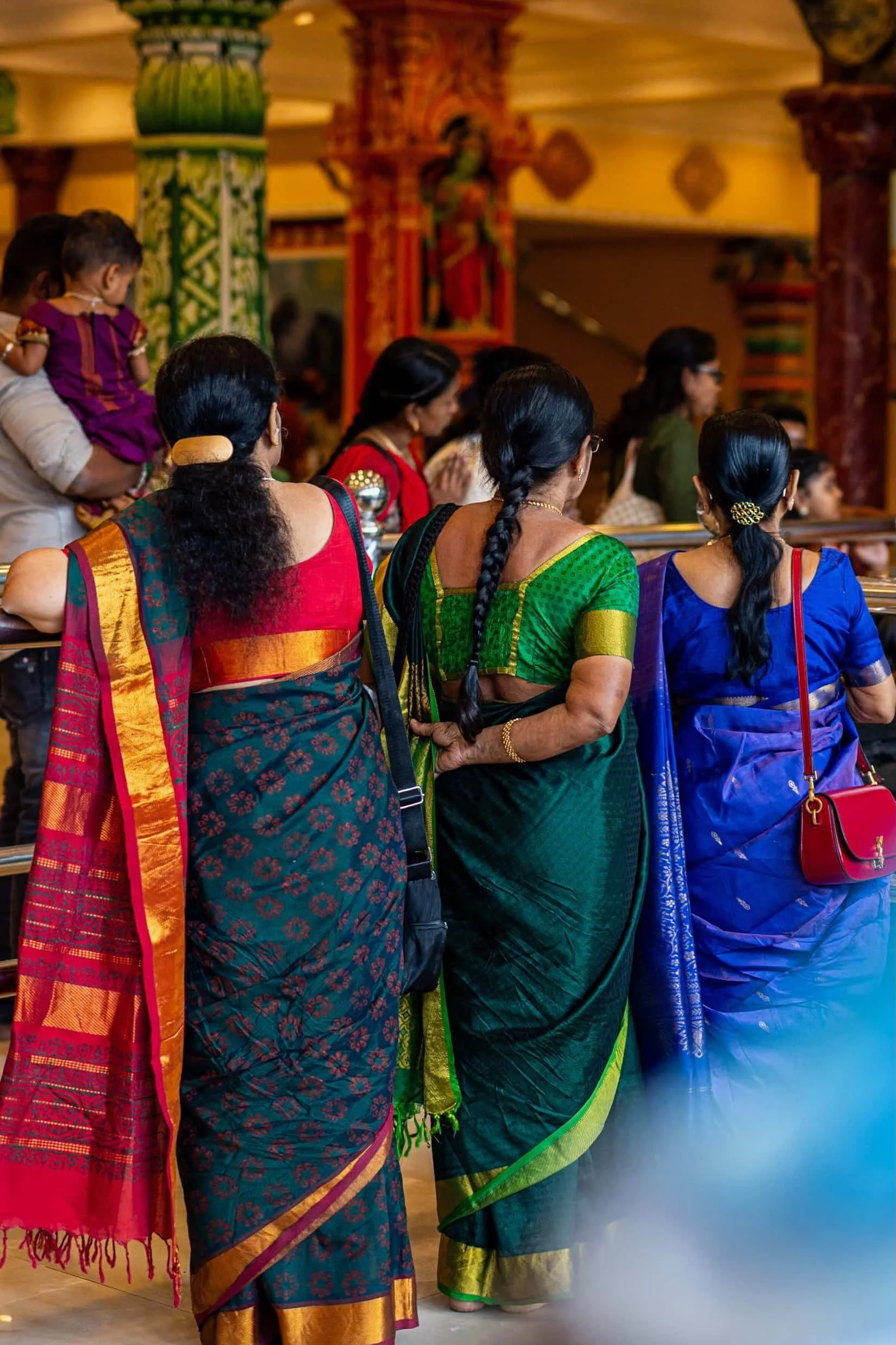 Indian women waiting in a queue to get inside the Lord Murugan temple in Malaysia