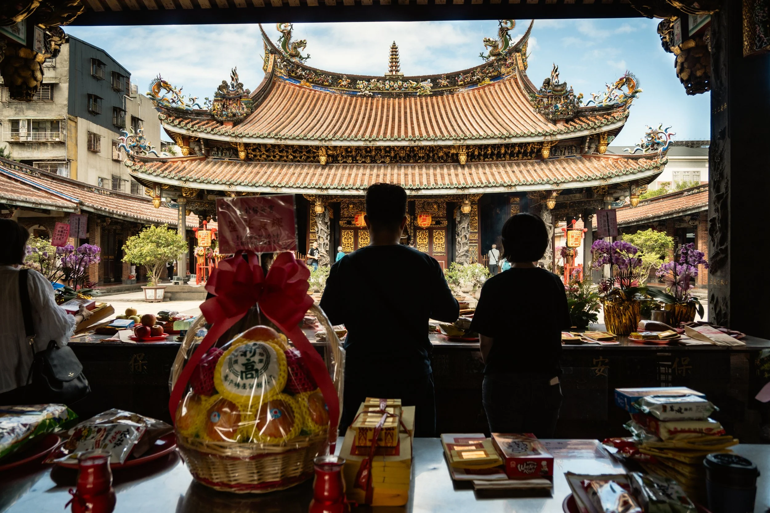boan temple people offering and praying in front of the temple in taipei taiwan