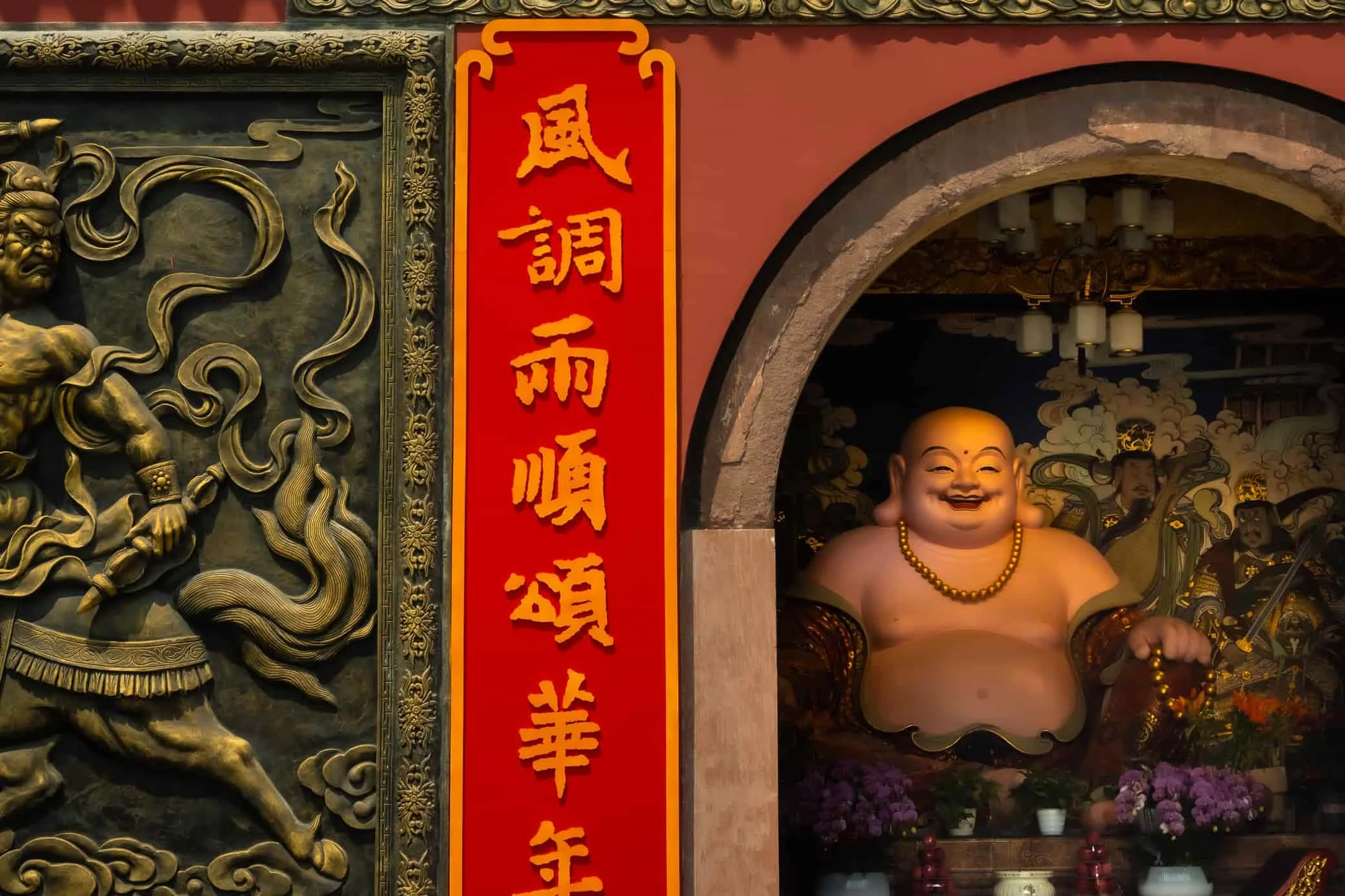 smiling buddha at entrance of temple in tianfu square in chengdu china