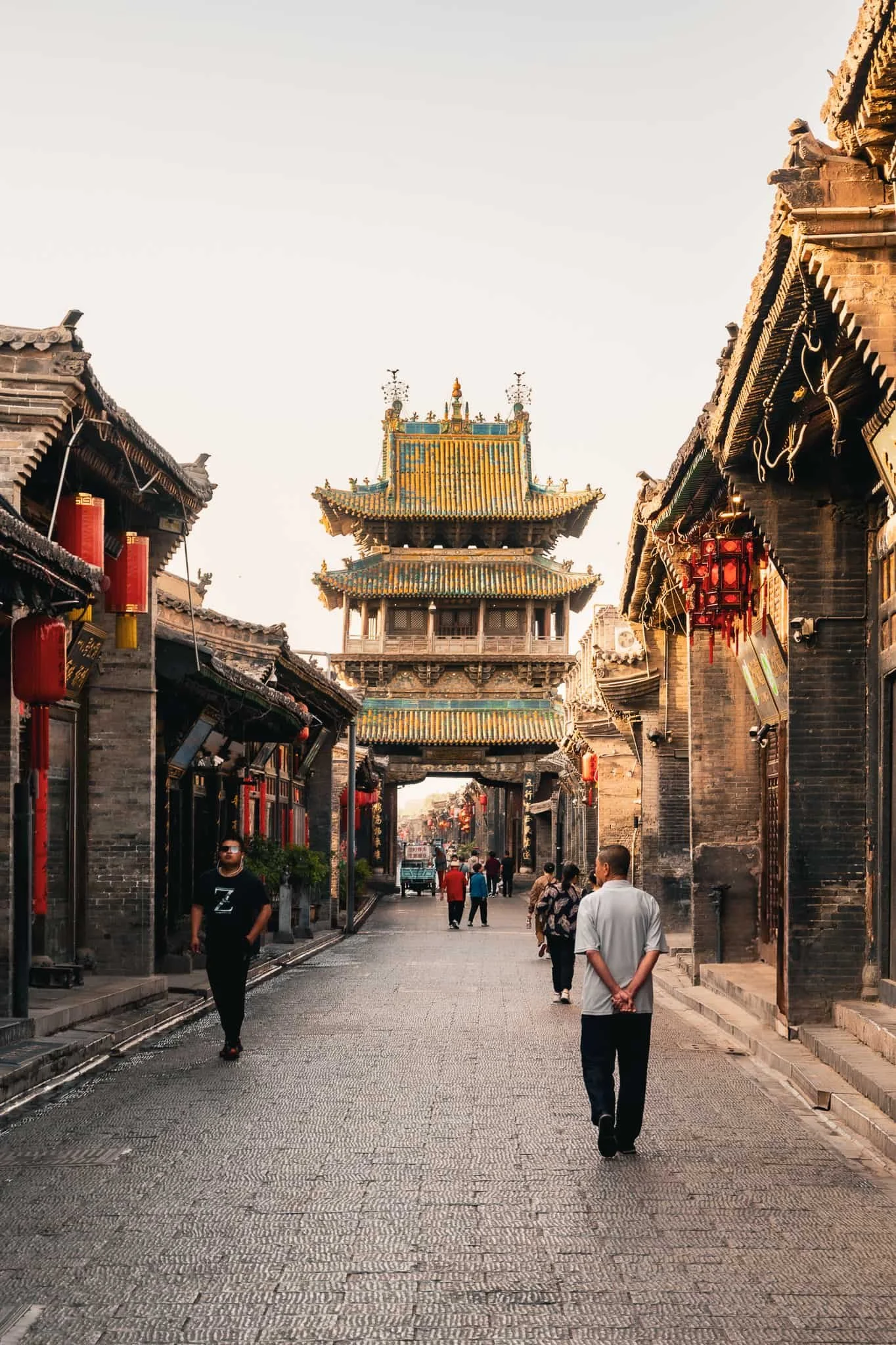 Locals and visitors making their way on the south gate entrance in Pingyao ancient city in China