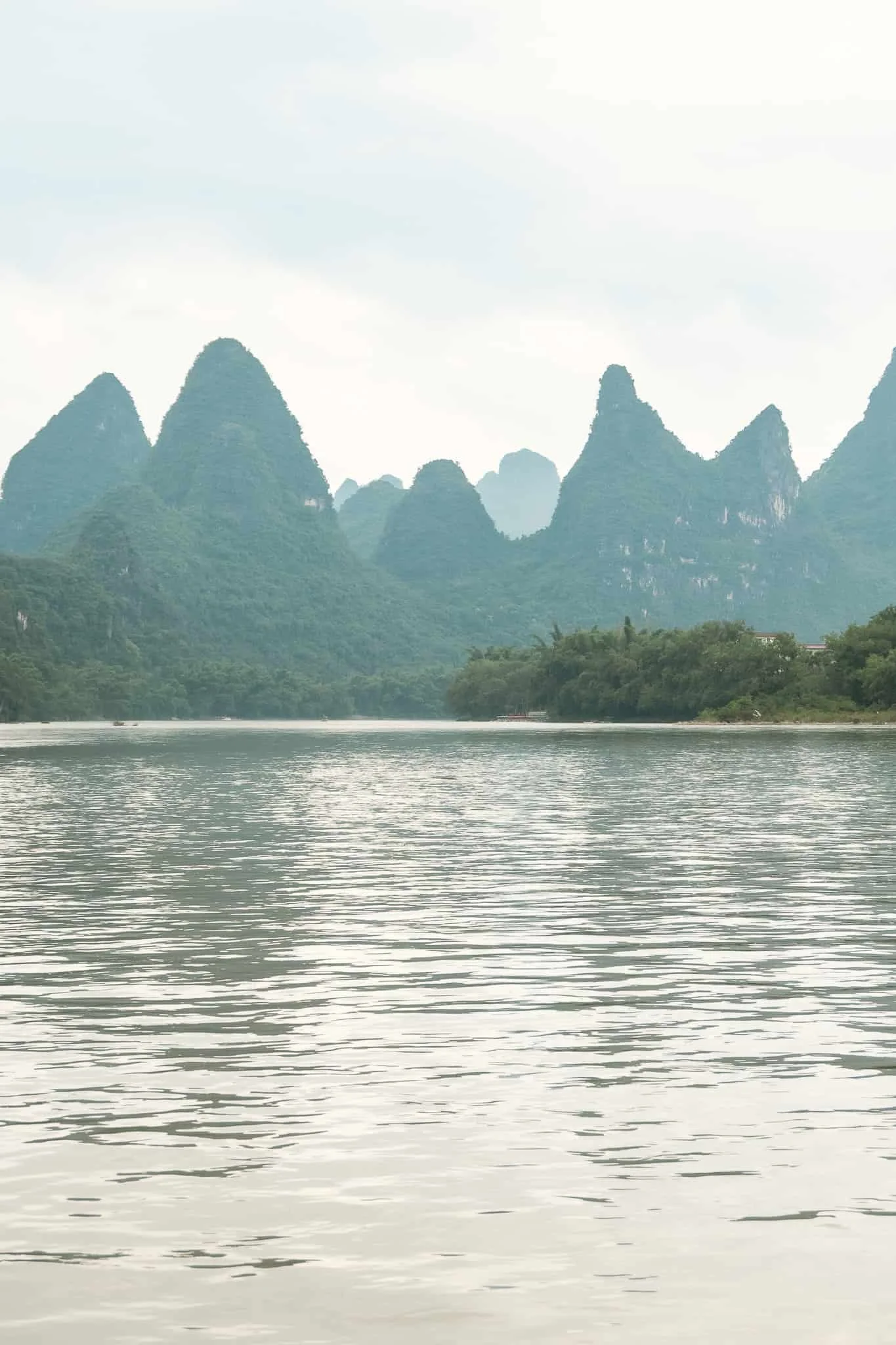cloudy day on famous yangshuo karst scenery from the river cruise views on a cloudy day before the rain stormed.