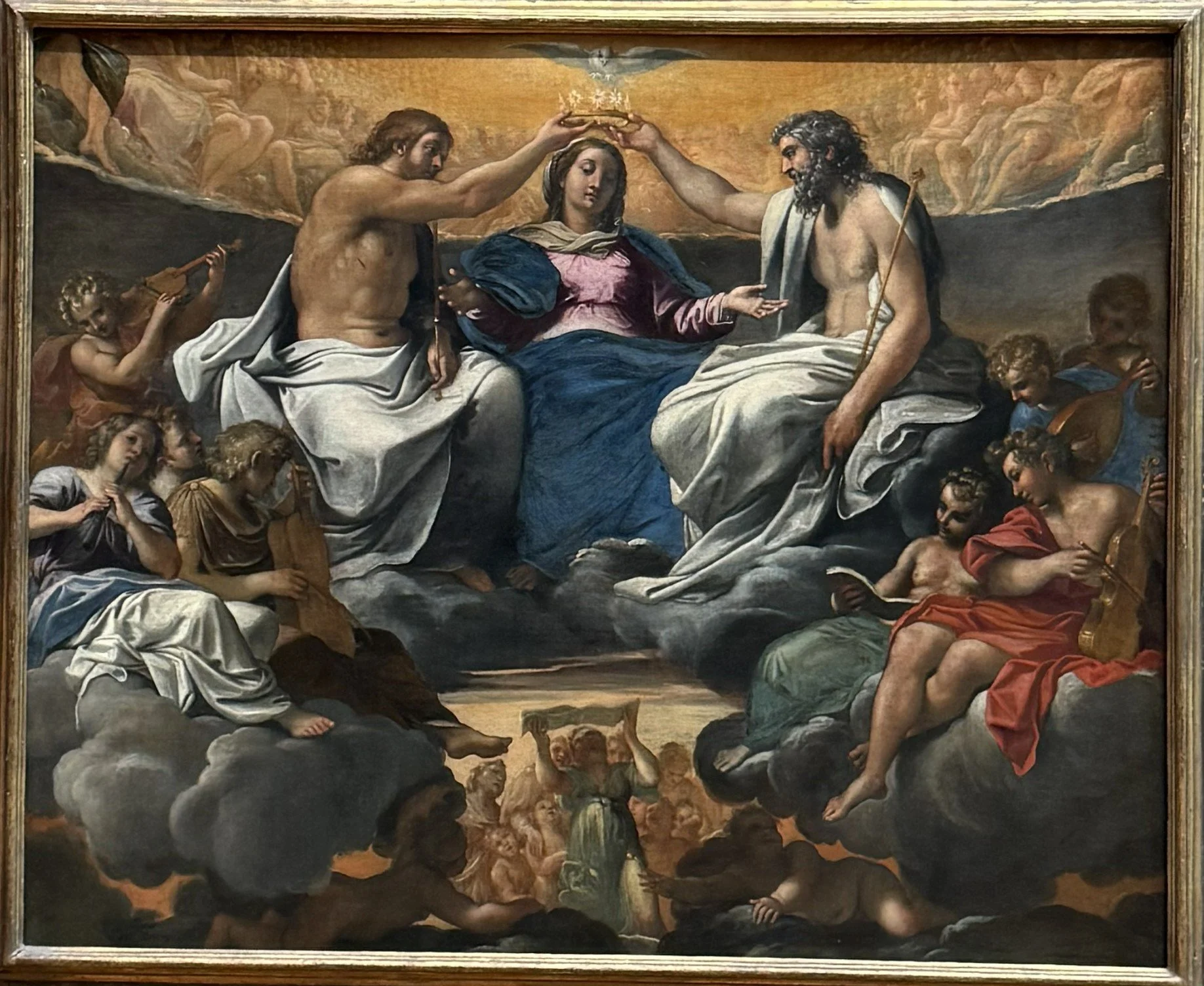 The Coronation of the Virgin (c.1595) Annibale Carracci. In this painting, the Virgin is depicted being crowned by the Holy Trinity. The Holy Spirit appears above her in the form of a dove, while God the Father and Christ the Son flank her on either 