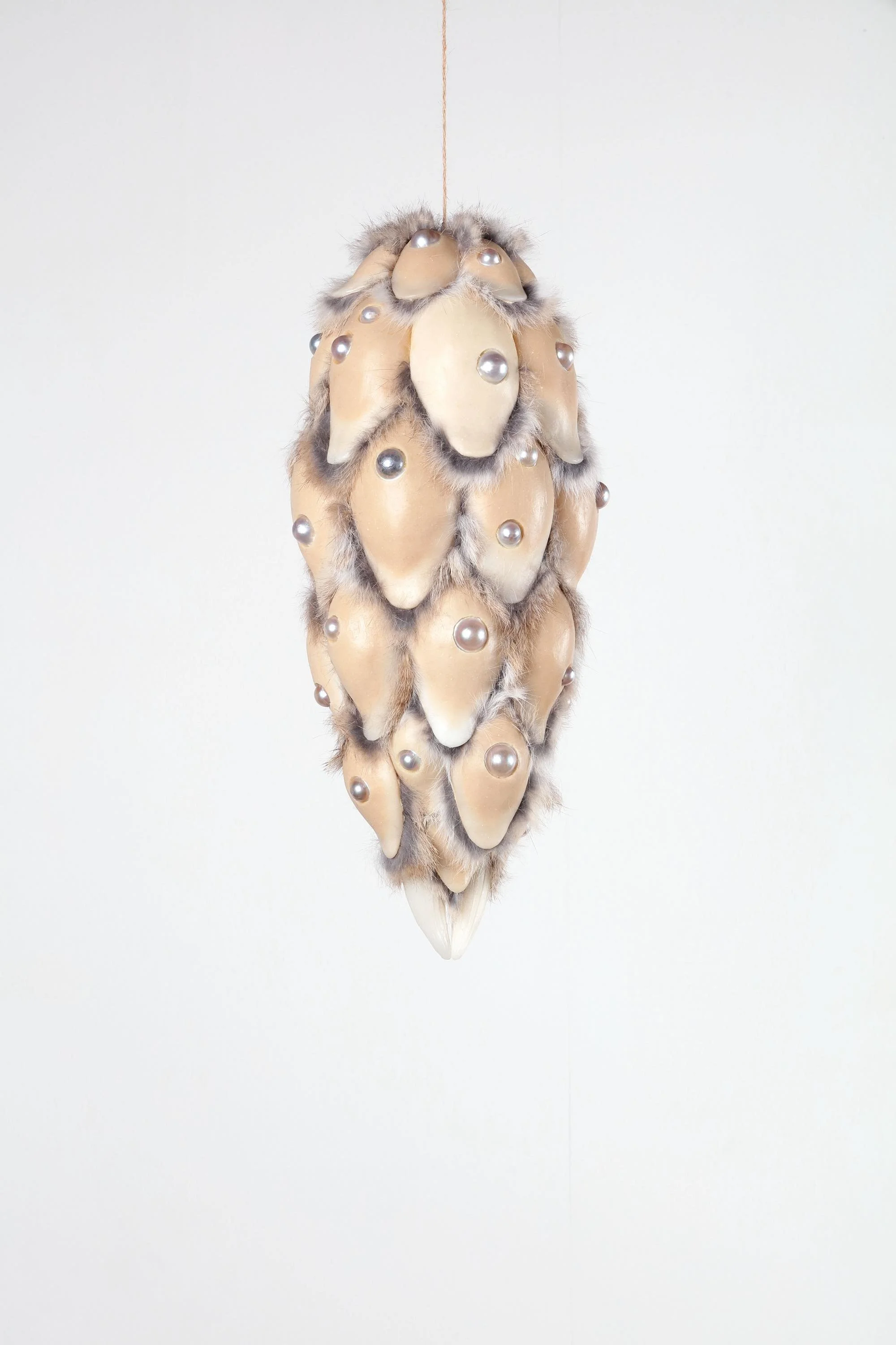 Prayer (pinaceae), 2024, h.45 x w.19 x d.19 cm, Silicone, licorice, pigment, rabbit fur, half-round pearl