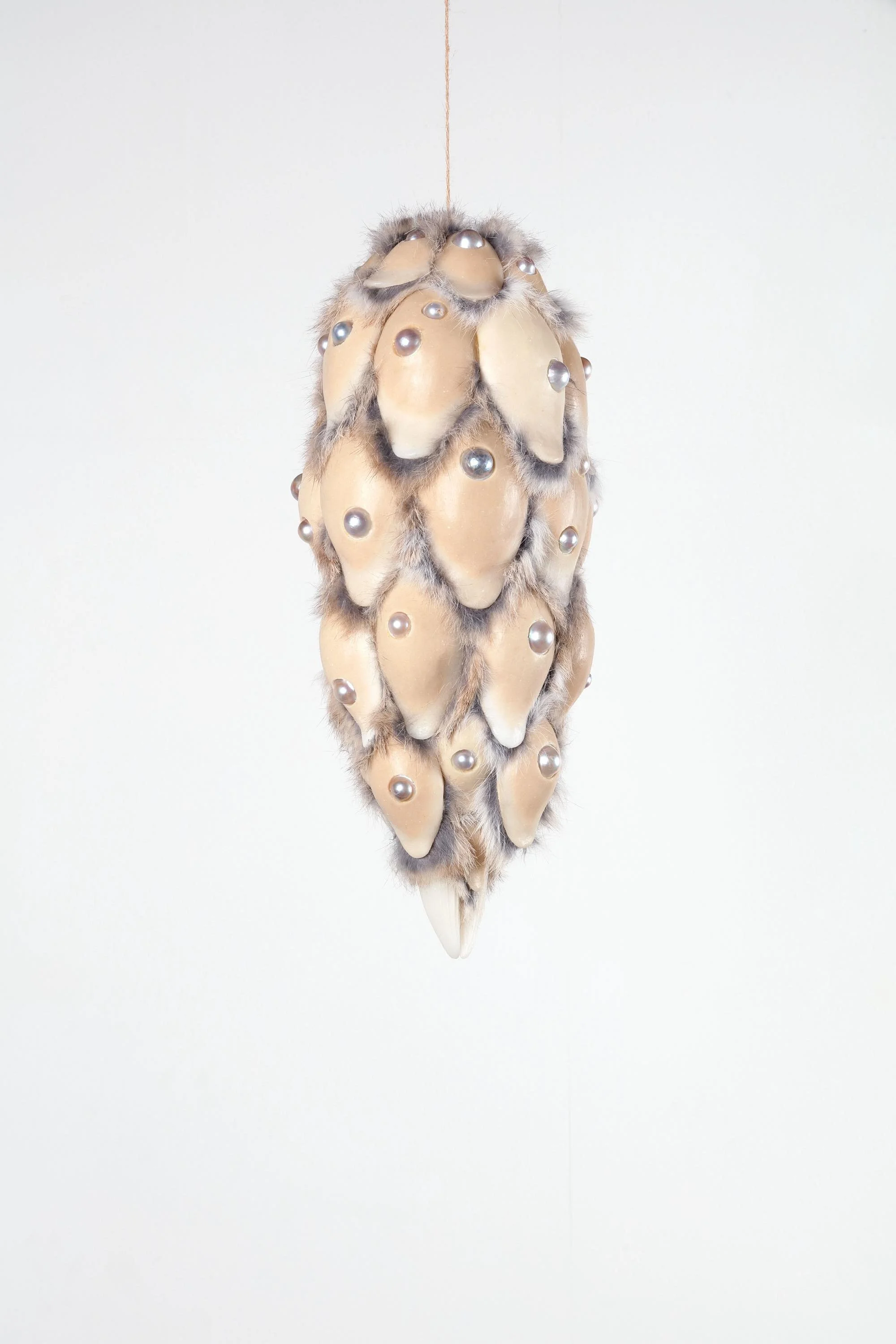 Prayer (pinaceae), 2024, h.45 x w.19 x d.19 cm, Silicone, licorice, pigment, rabbit fur, half-round pearl
