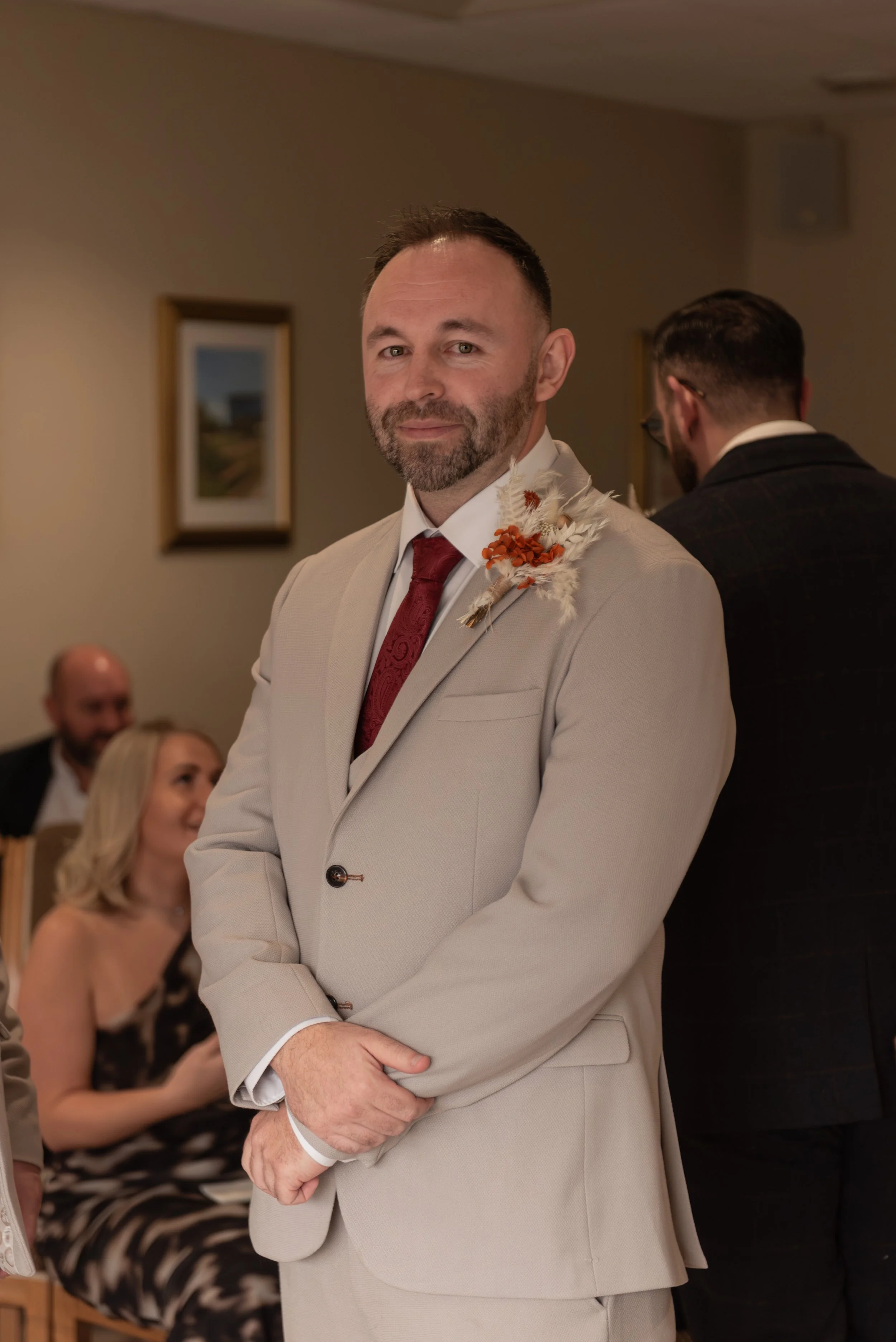 groom waits for bride, wedding photography at caerphilly registry office