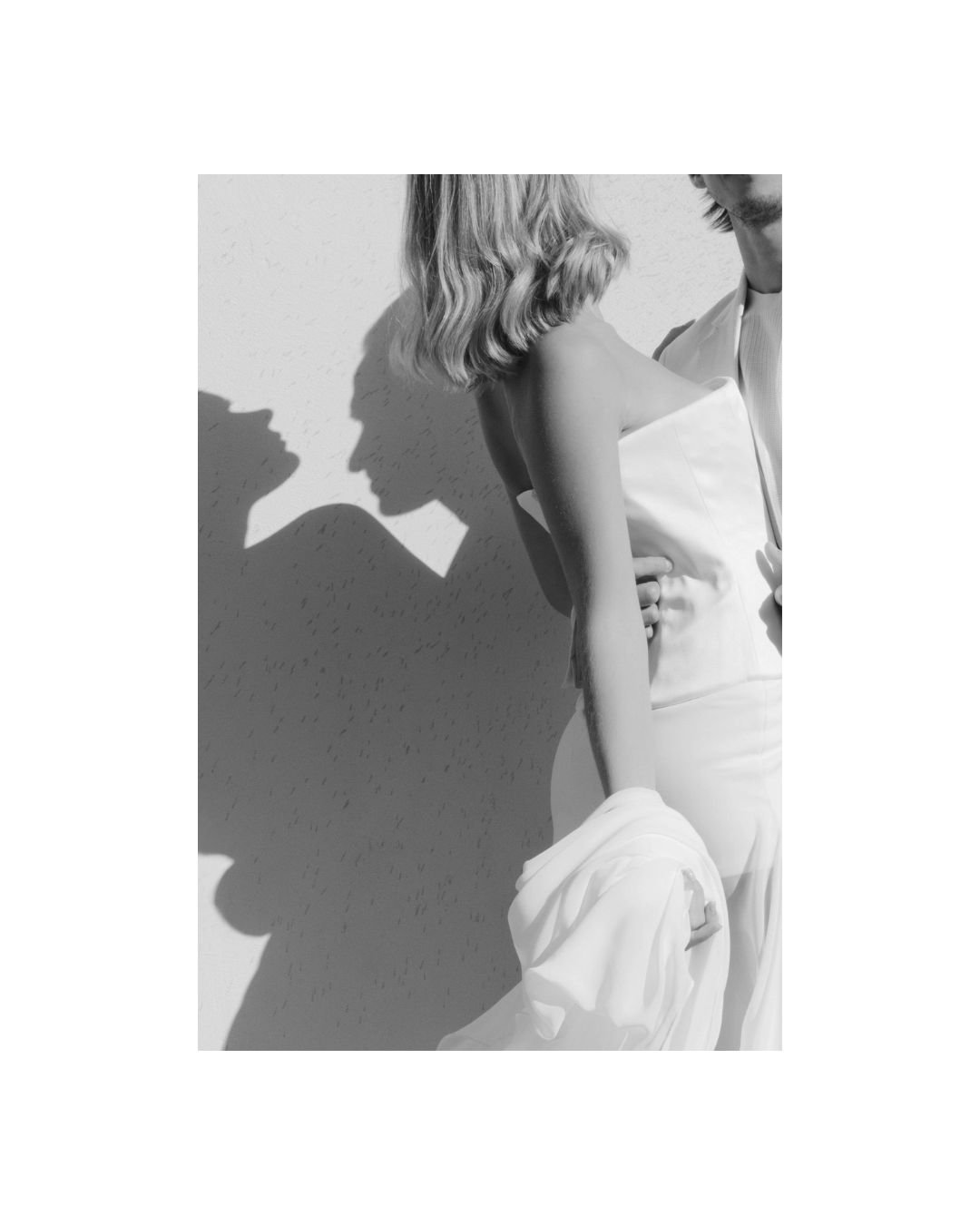 A fine art black and white wedding portrait where light and shadow sculpt the bride’s form, creating a timeless Italian editorial moment that feels both intimate and iconic at the luxury wedding venue Braccialieri in sicily