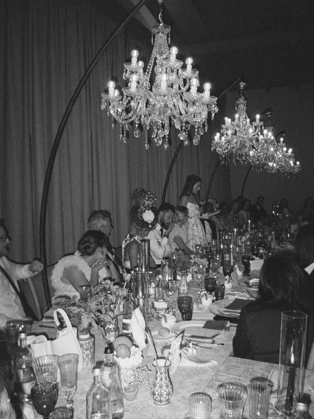 @podere_tesoro tuscany wedding on 35mm film.

the dinner was unapologetically elegant. crystal chandeliers hanging low over the tables. glass catching reflections everywhere. guests dressed in the way you often see with london wardrobes and well-cut 