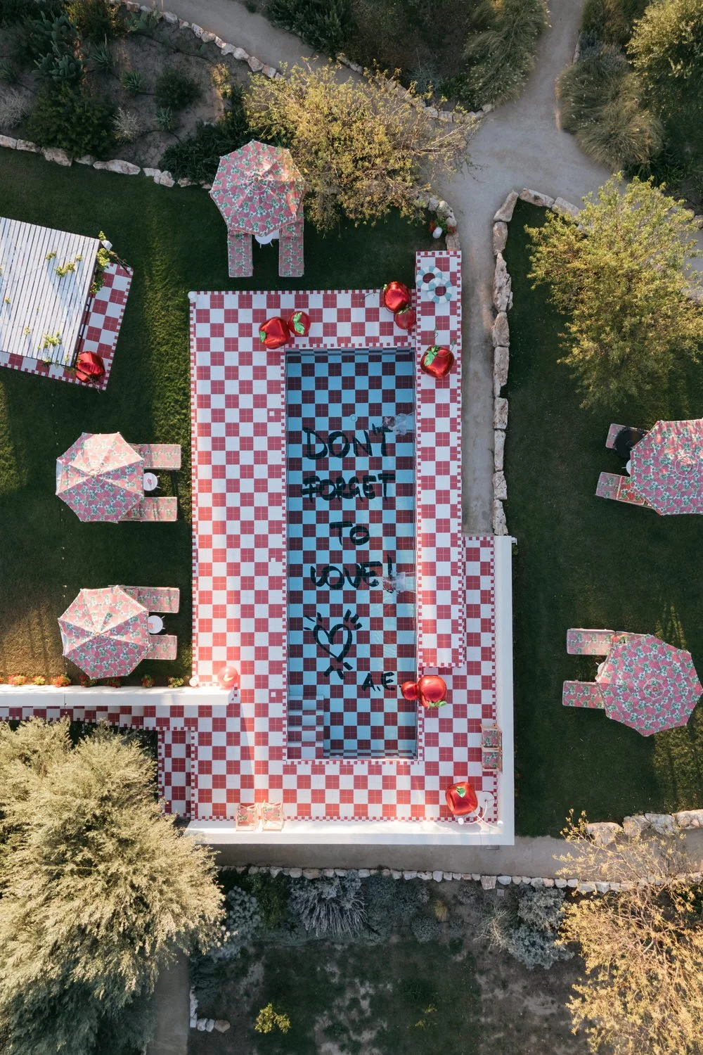 Iconic red and white checkered pool inspired by vintage Italian kitchens, designed by Alessandro Enriquez for a bold and candid braccialieri sicily wedding
