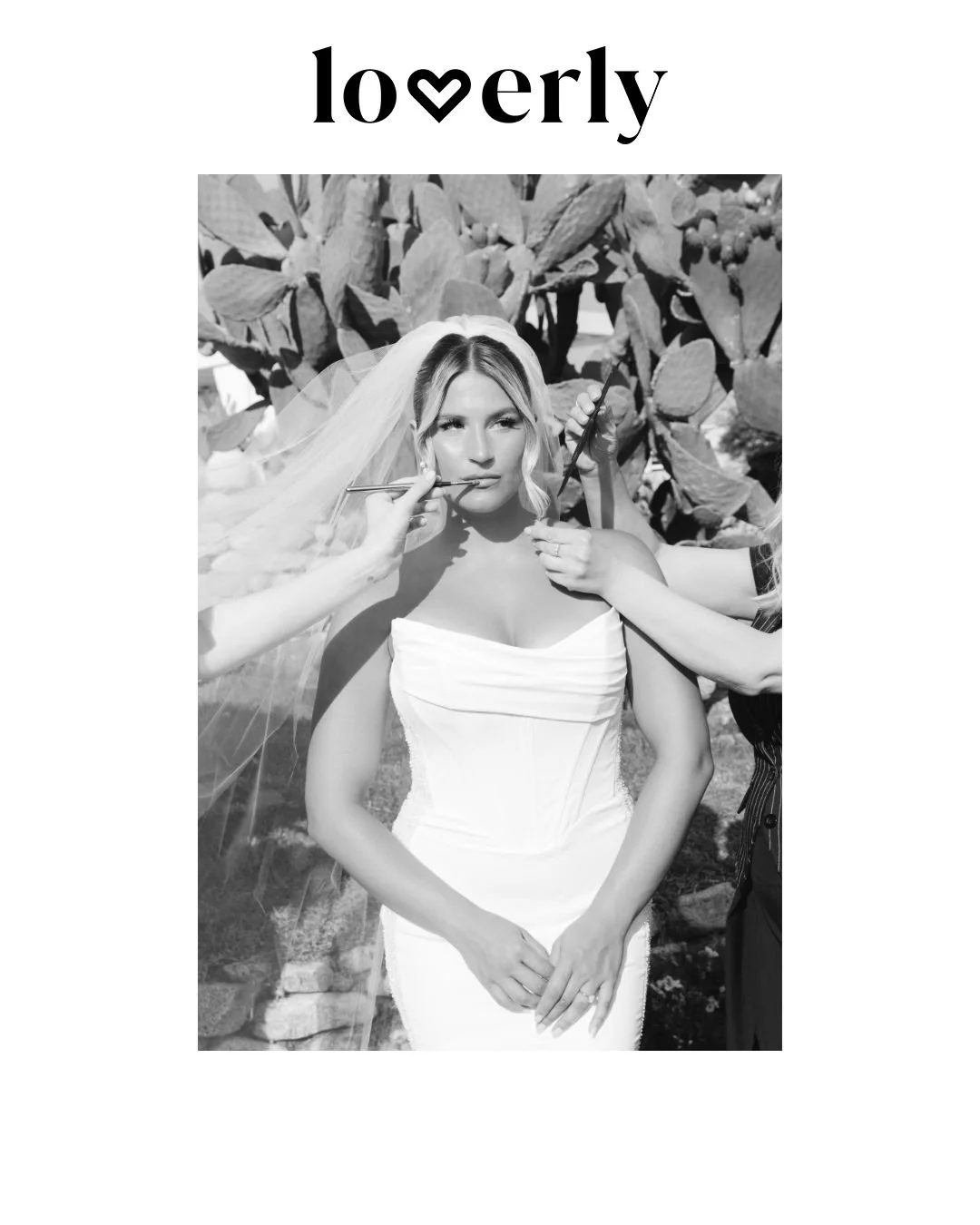 Bride getting ready with stylists. A black-and-white portrait of a bride having final touches done, surrounded by cactus plants, during bridal prep at a Commenda San Calogero wedding in Sicily
