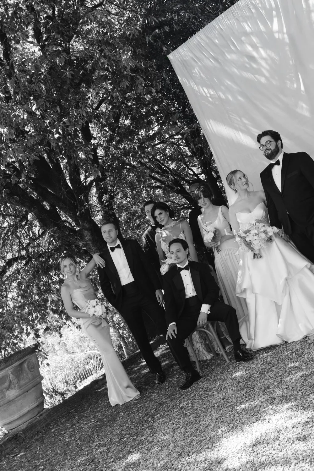 black-and-white palagina tuscany wedding editorial bridal party photo under the trees