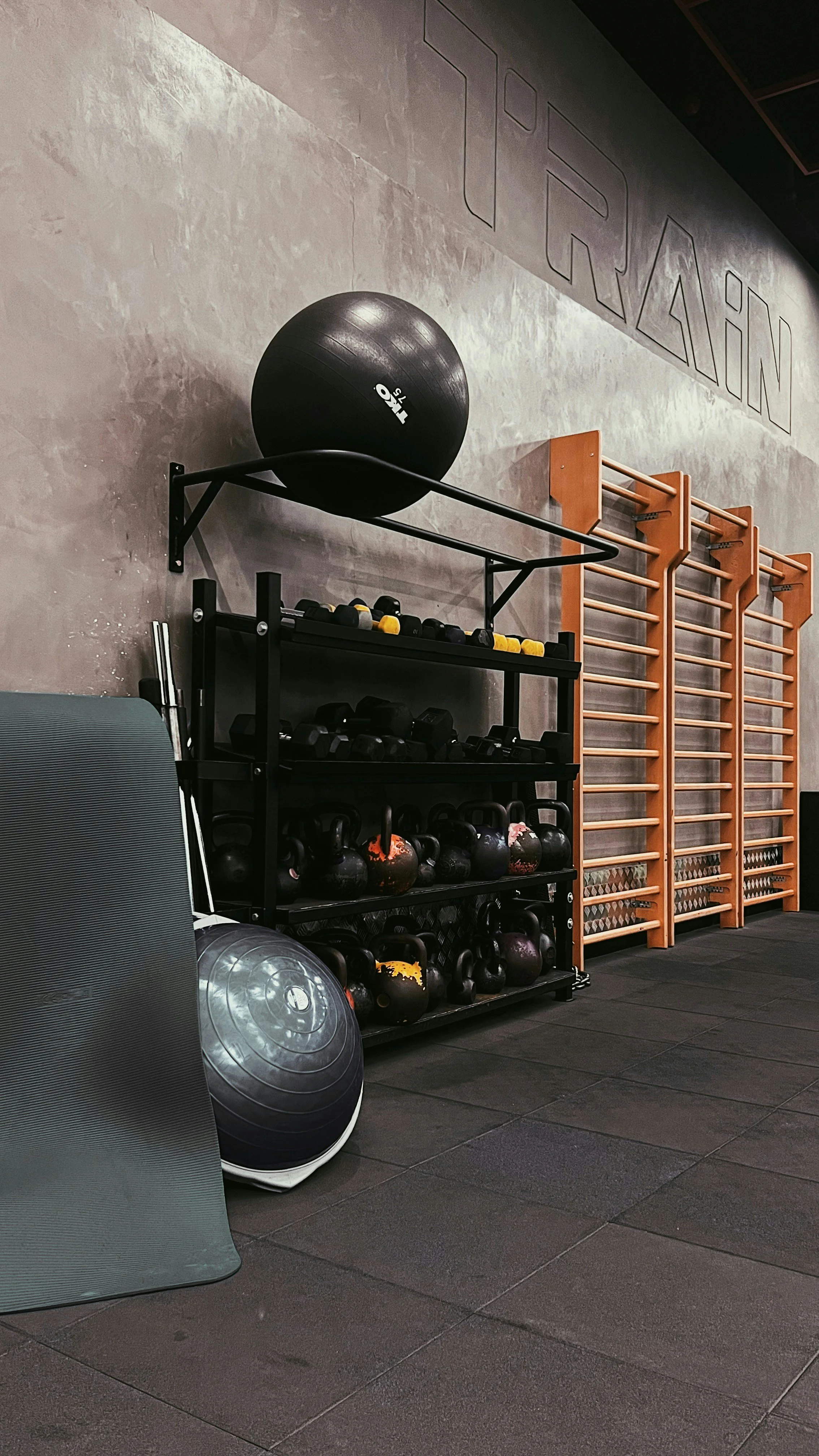 Gym equipment neatly stored with storage solutions