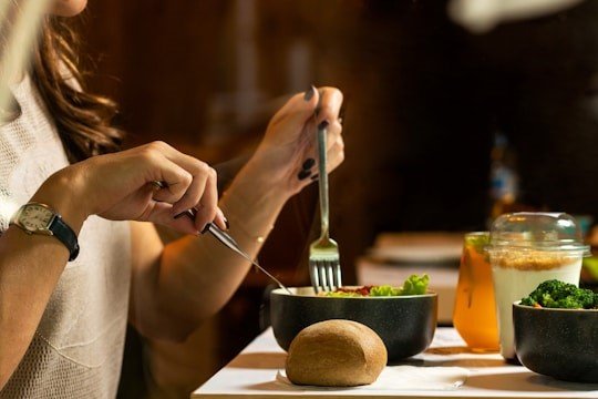 person-holding-silver-fork-and-knife