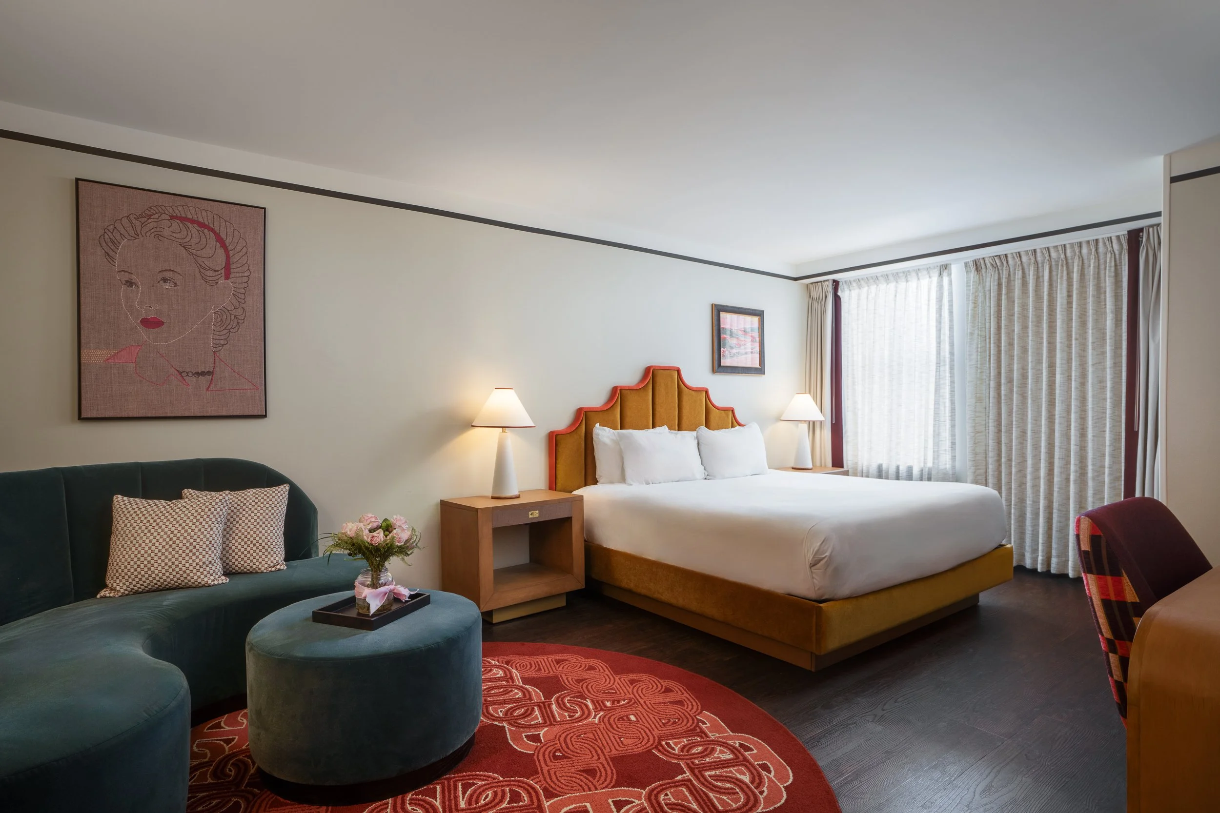 Luxury boutique hotel room with warm layered lighting, rich textiles, and moody ambient atmosphere