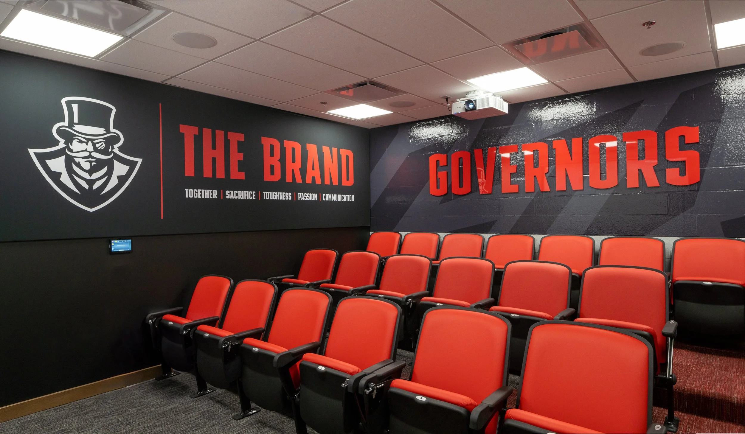 Large meeting room for a sports team with tiered seating.