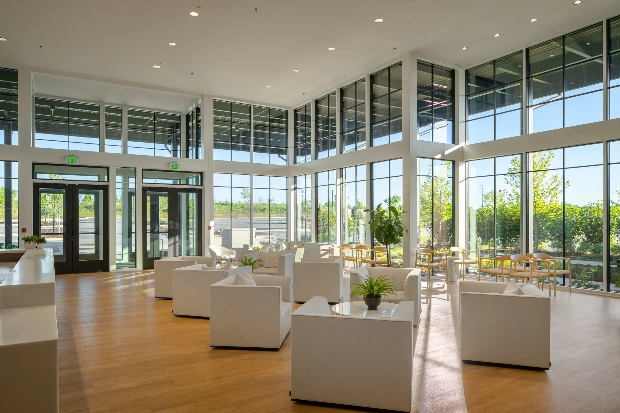 Spacious lobby with natural light and glass panels.