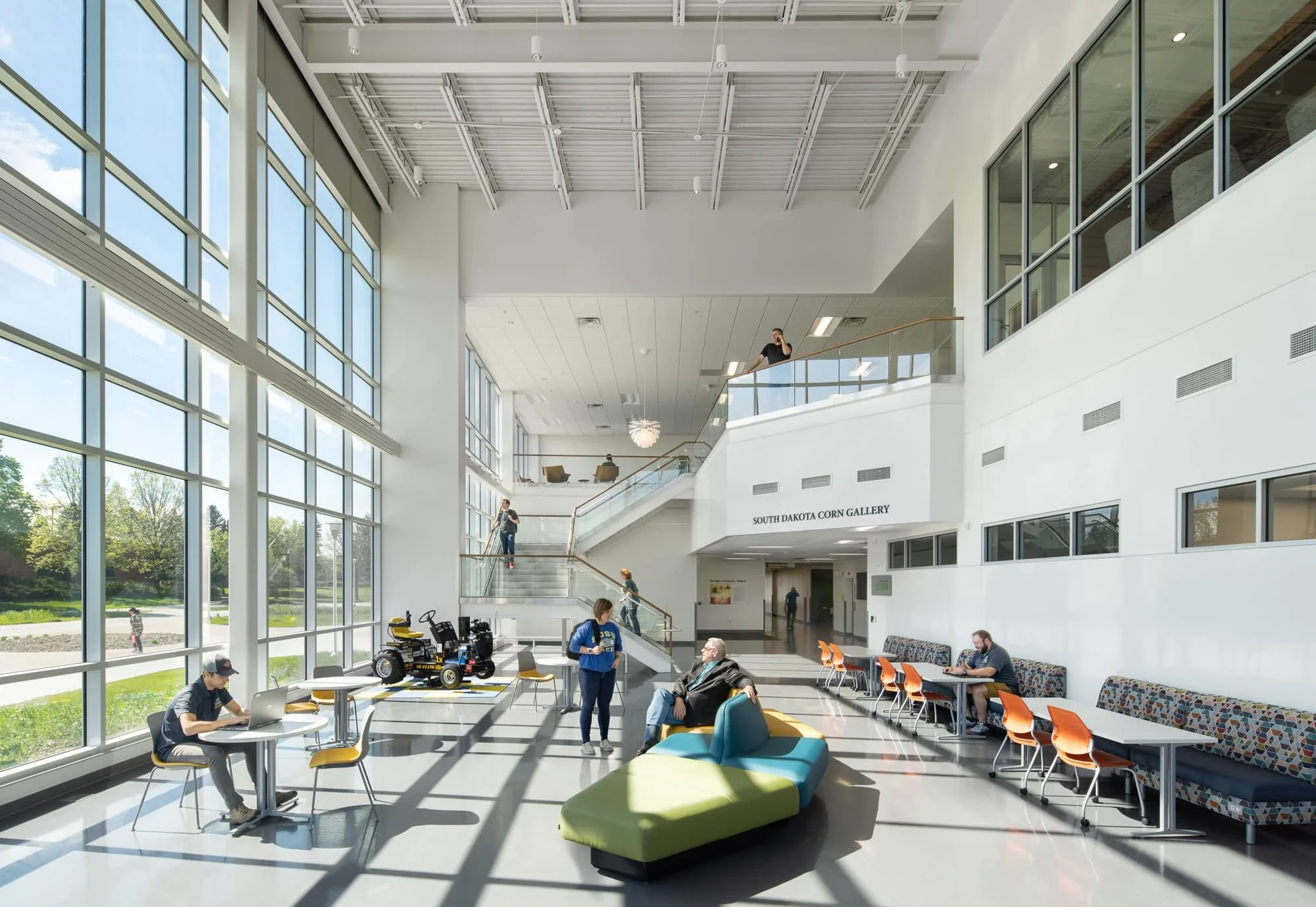 Daylit interior atrium at South Dakota State University with architectural light patterns crossing the floor