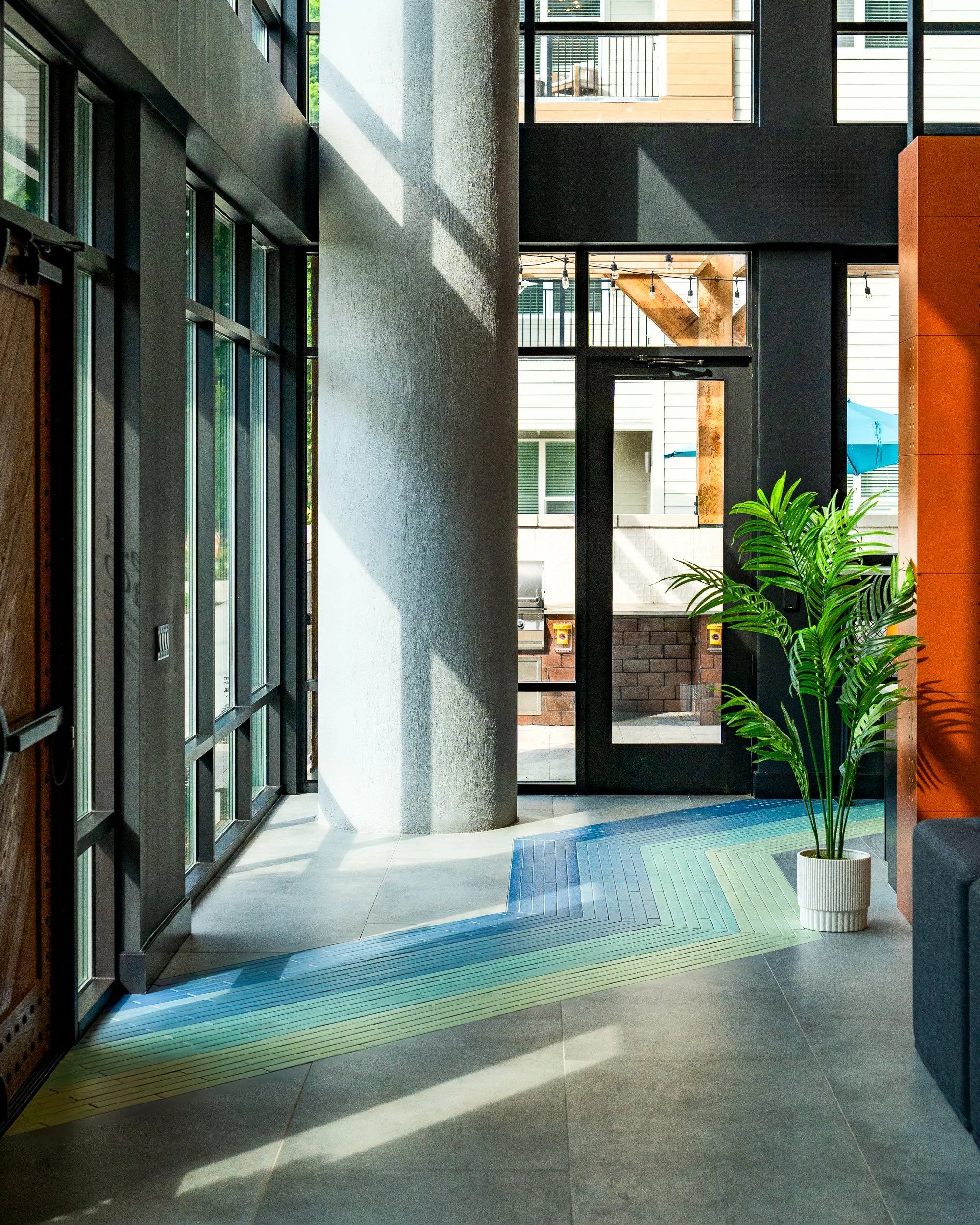 Bright entryway with colorful tiles in a modern residential building.