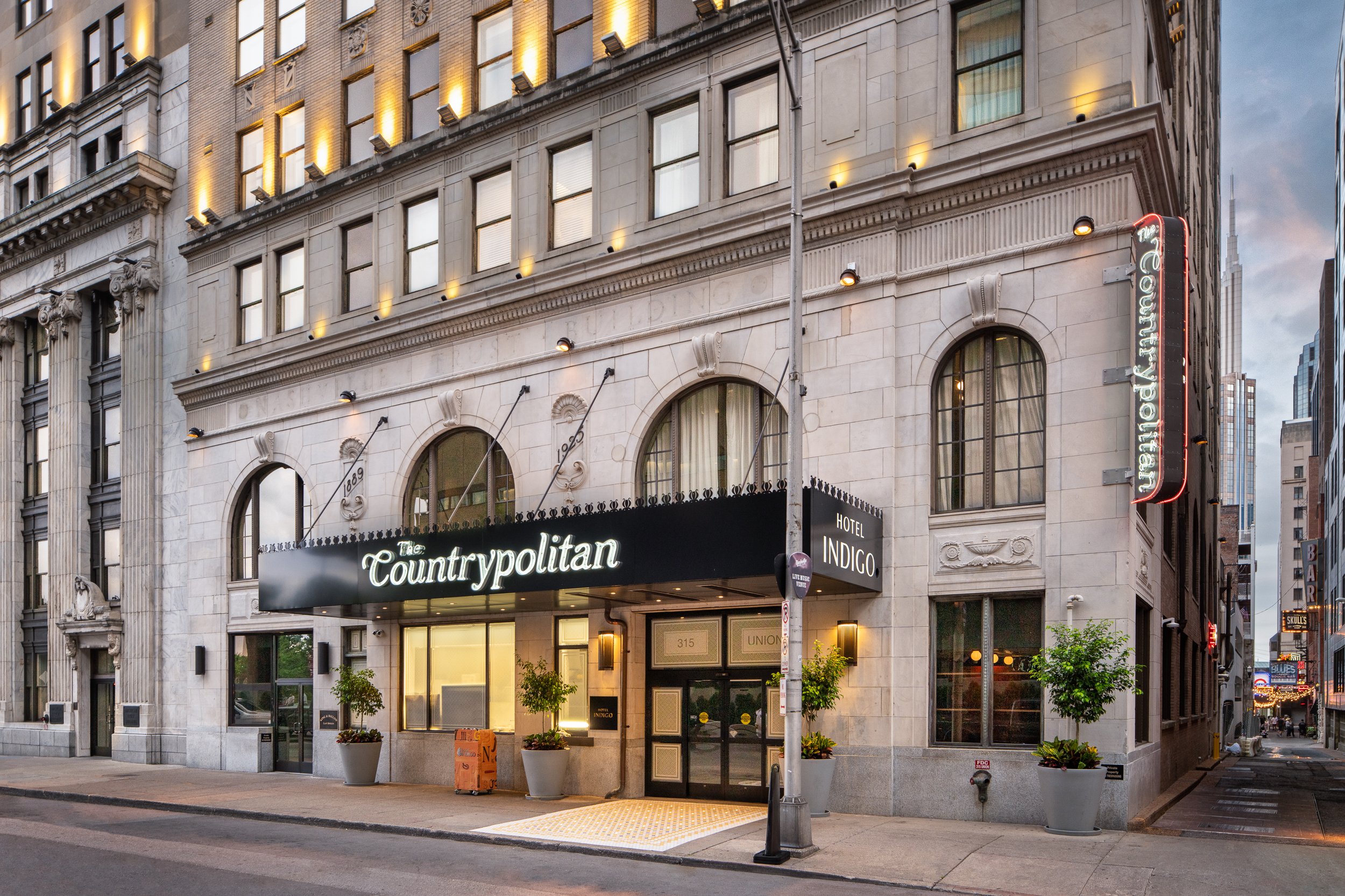 Historic hotel main entrance with warm lighting, ornate detailing, and a renovated facade in downtown Nashville
