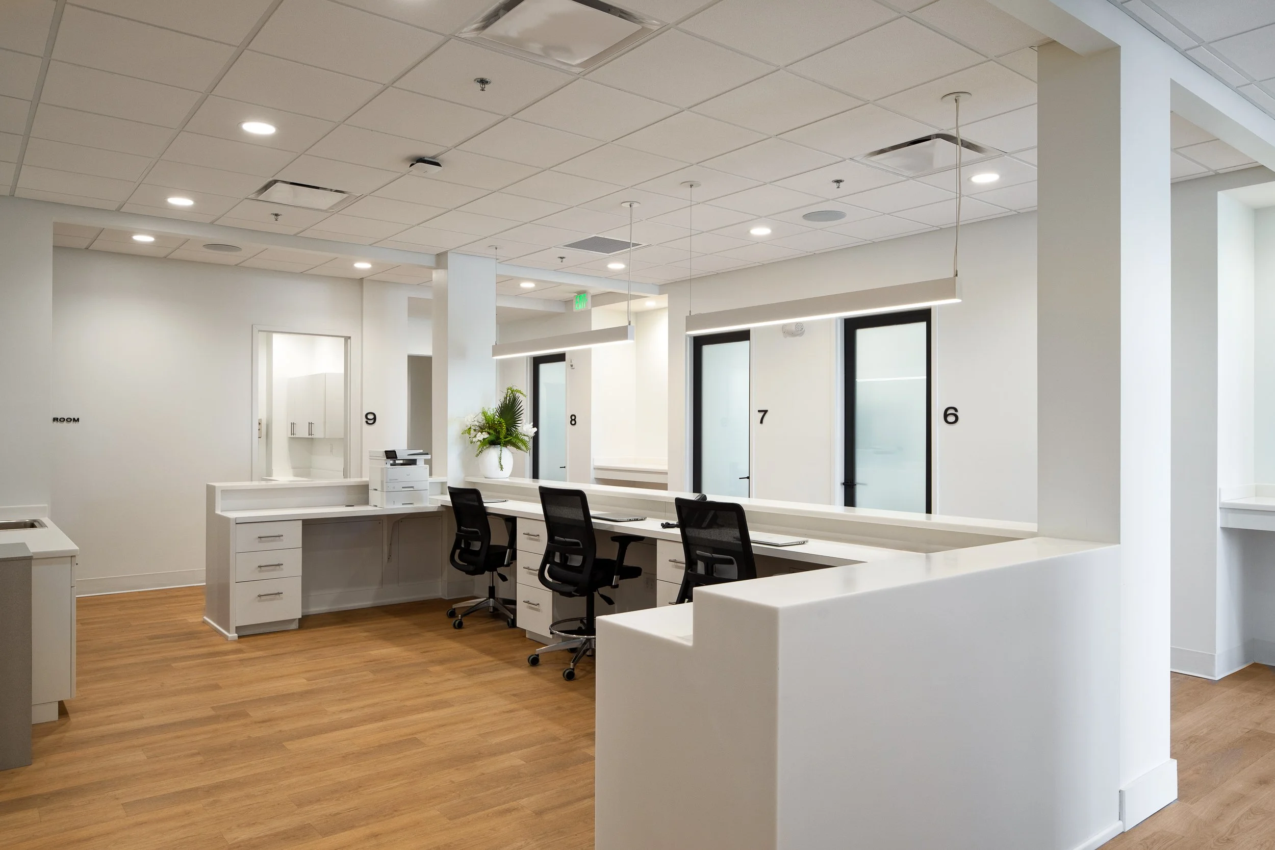 Open workspace with minimalist furniture and natural lighting.