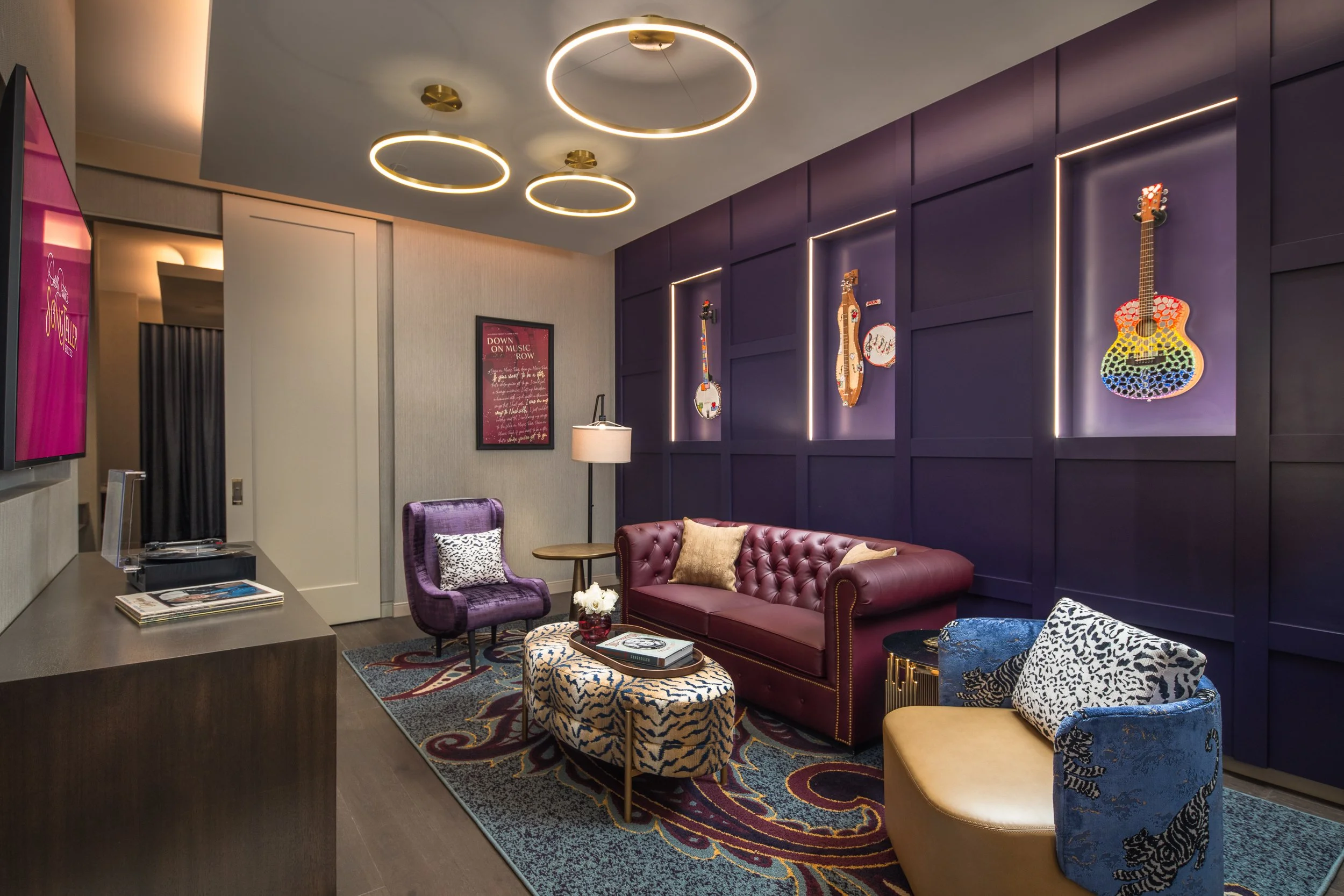An architectural photograph of a room with guitar displays in Dolly Parton's SongTeller Hotel