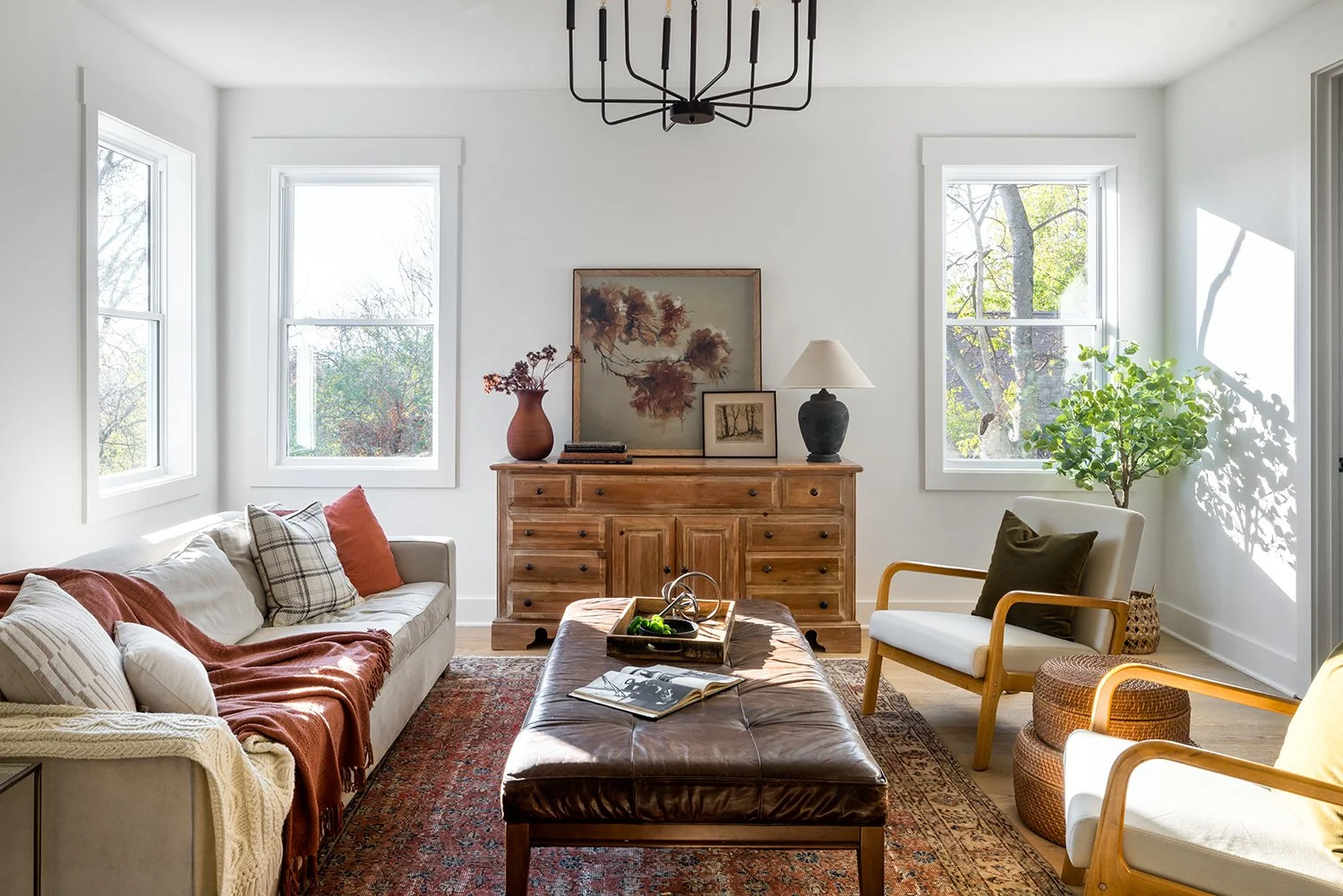 Cozy living room with warm lighting and vintage decor.