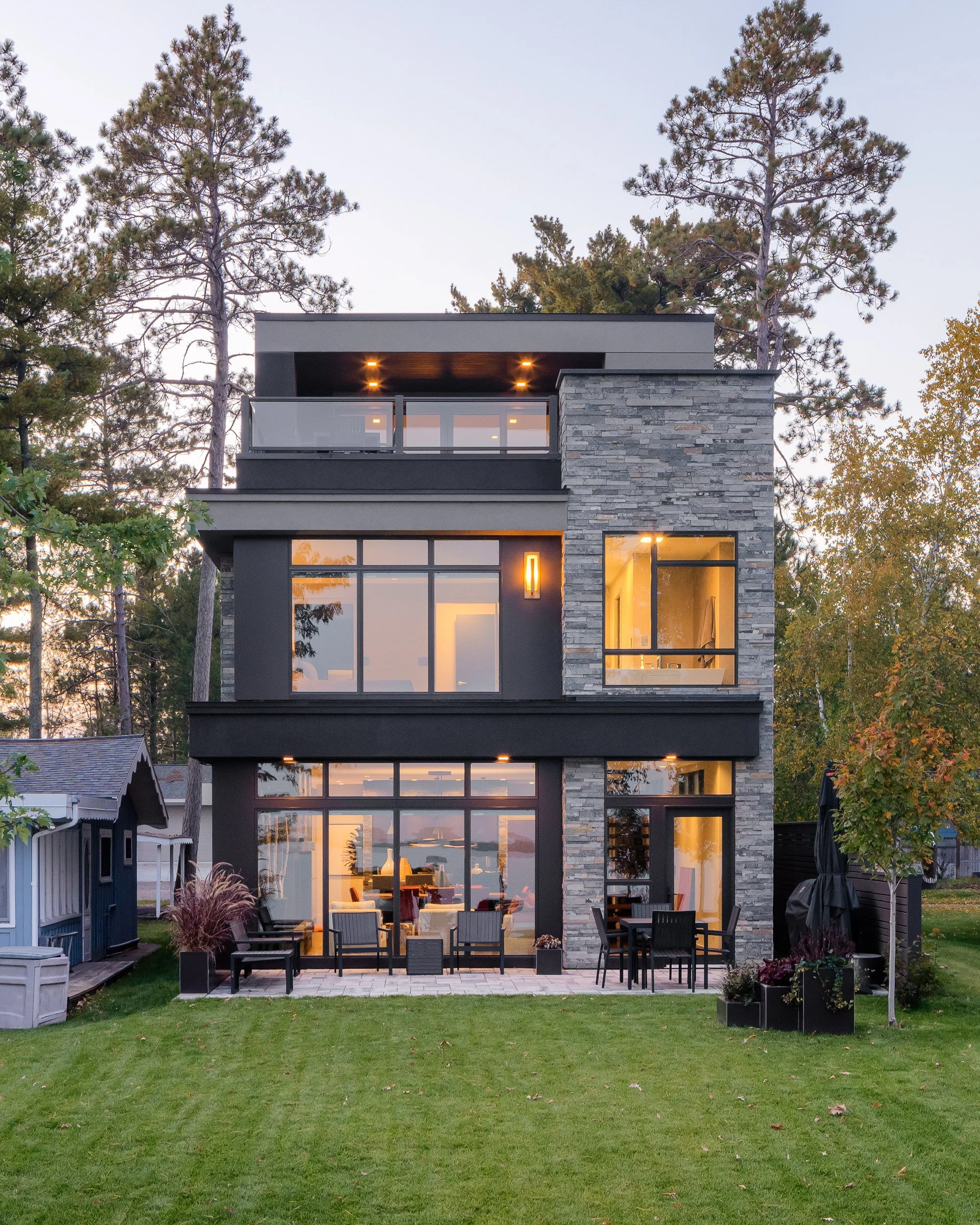 Modern home exterior with stone accents and large windows in Bemidji, Minnesota.