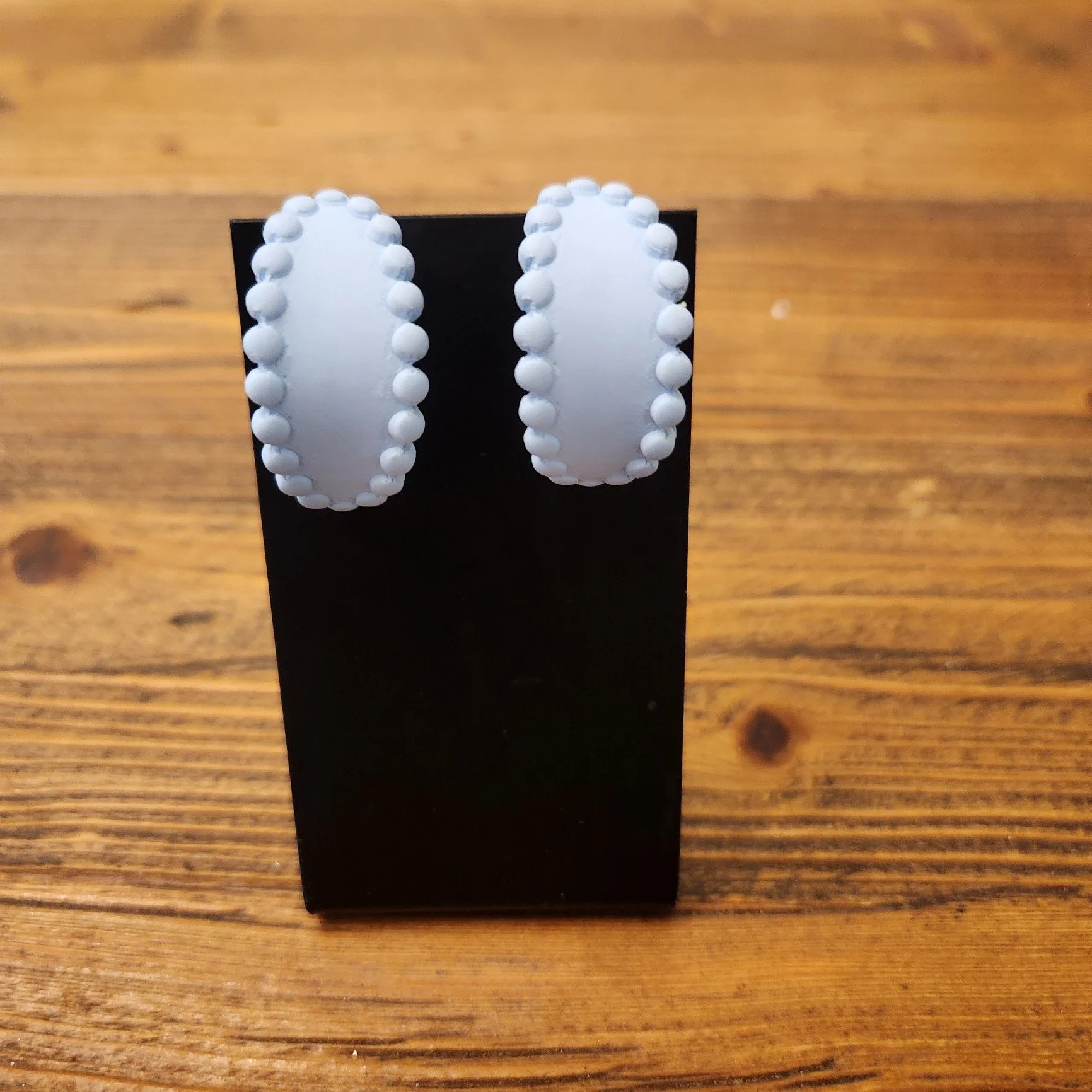 F7230 - OVAL BLUE HUGGIE HOOP EARRINGS.jpg