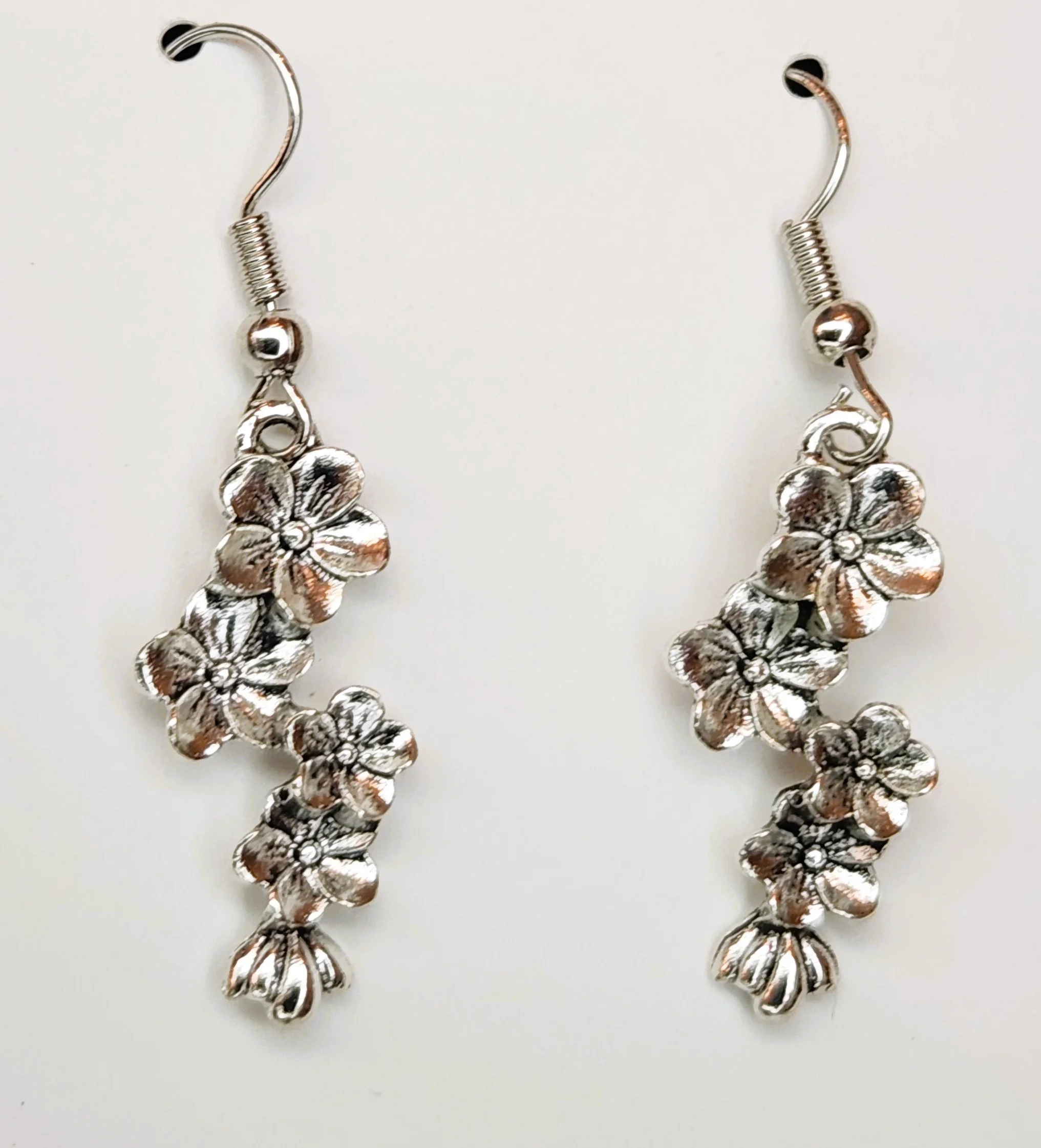 SILVER FLORAL DANGLE EARRINGS