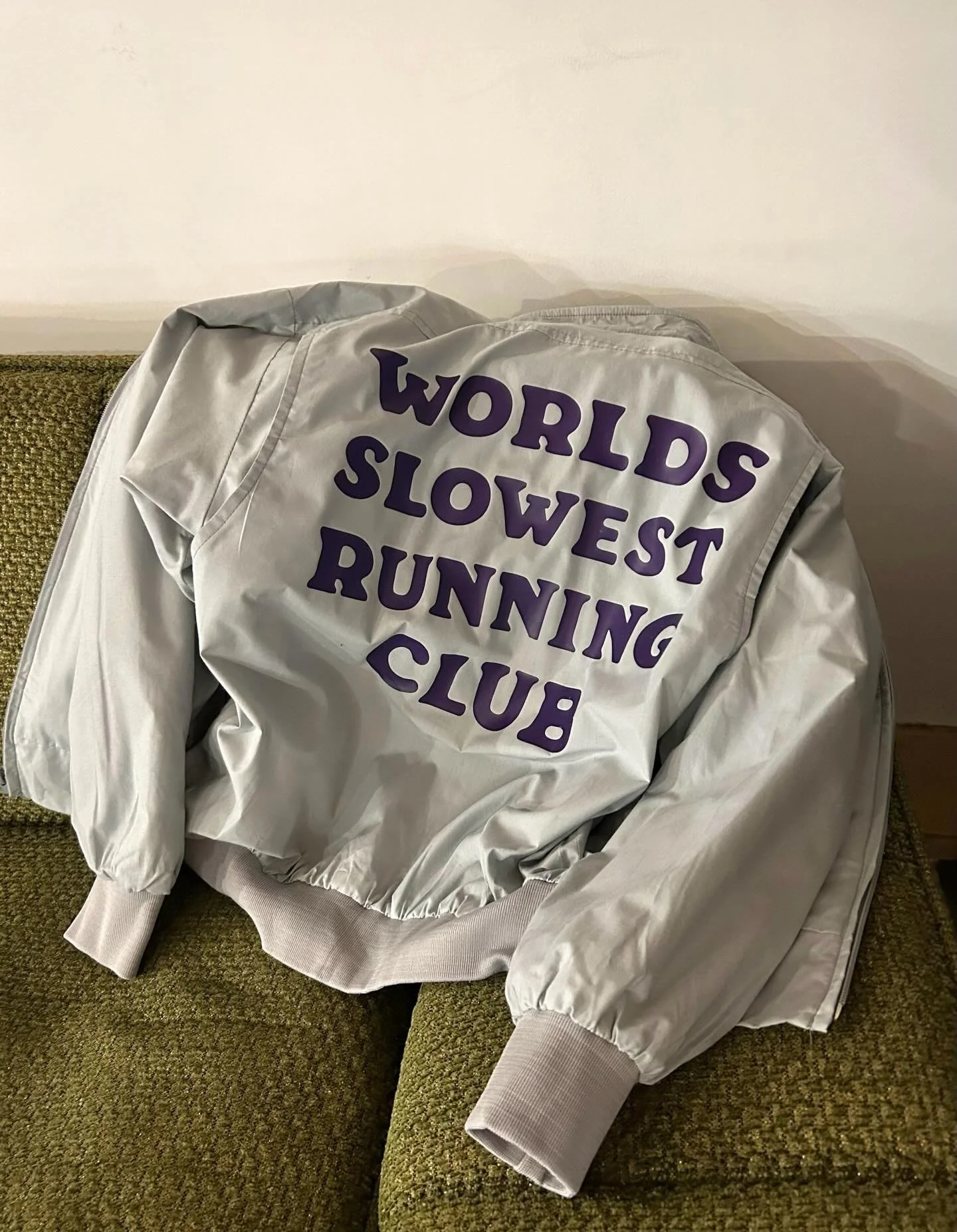 Hand-drawn lettering for @oleocoffee on vintage windbreakers. Plus an Ollie cameo. 🐌