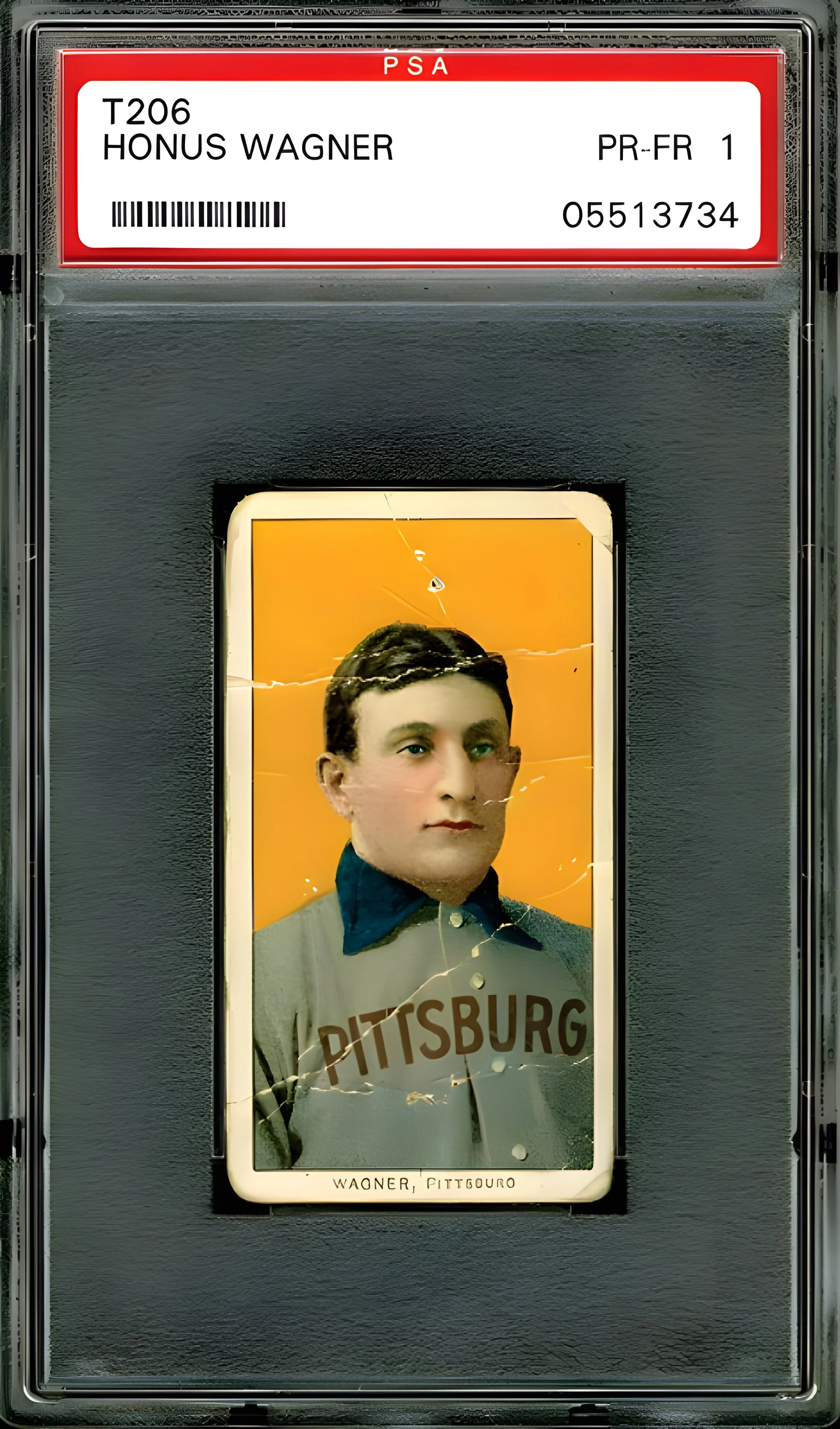 A vintage phone booth with a cracked screen displaying an old portrait of a woman with short dark hair. The woman is wearing a gray coat and a blue collar, against an orange background. The booth has a red and white label at the top with the name 'HO