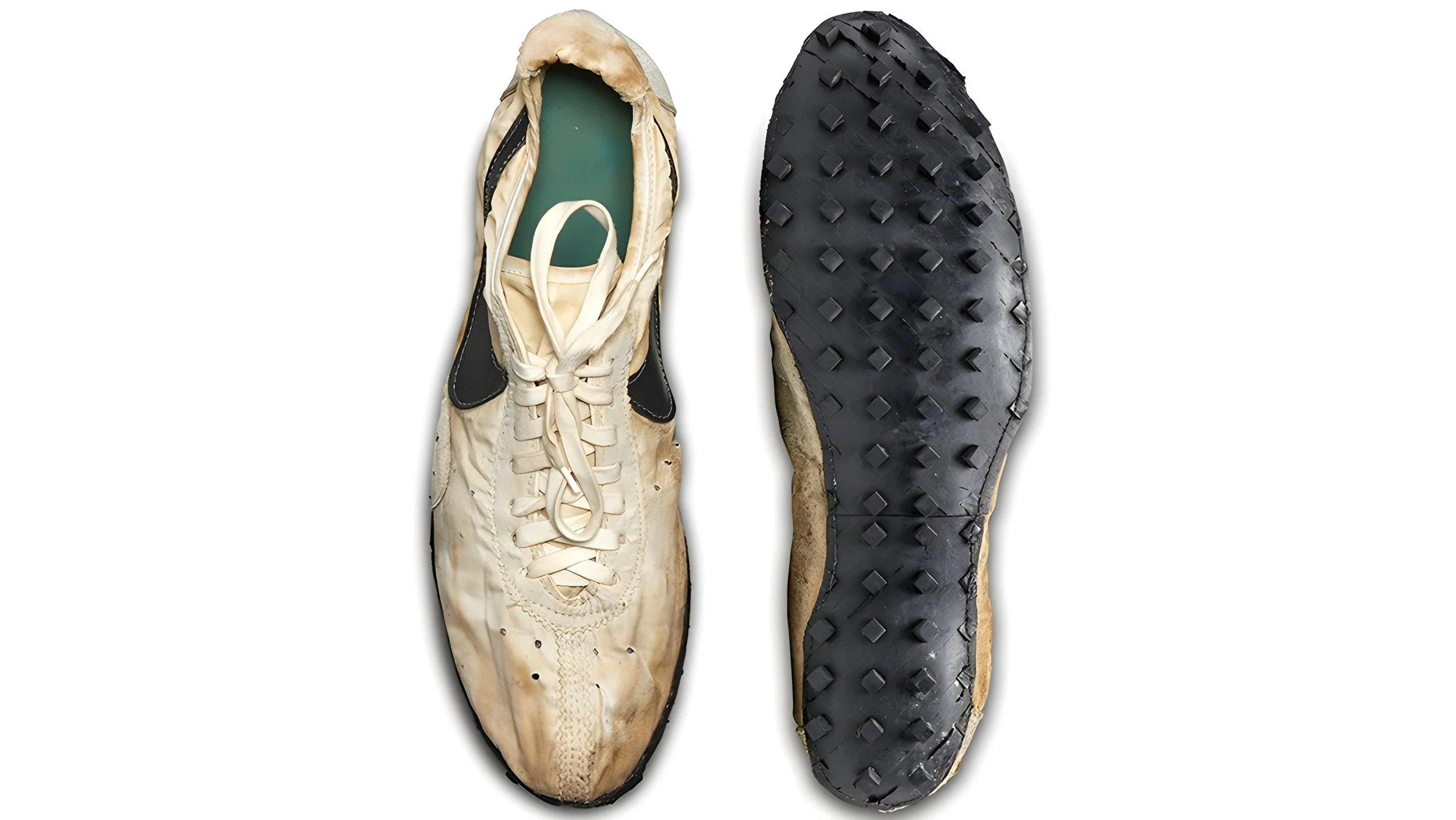 A pair of well-worn beige and black athletic shoes with a green insole, showing the top view of the left shoe and the bottom view of the right shoe, with the soles featuring a diamond pattern tread.