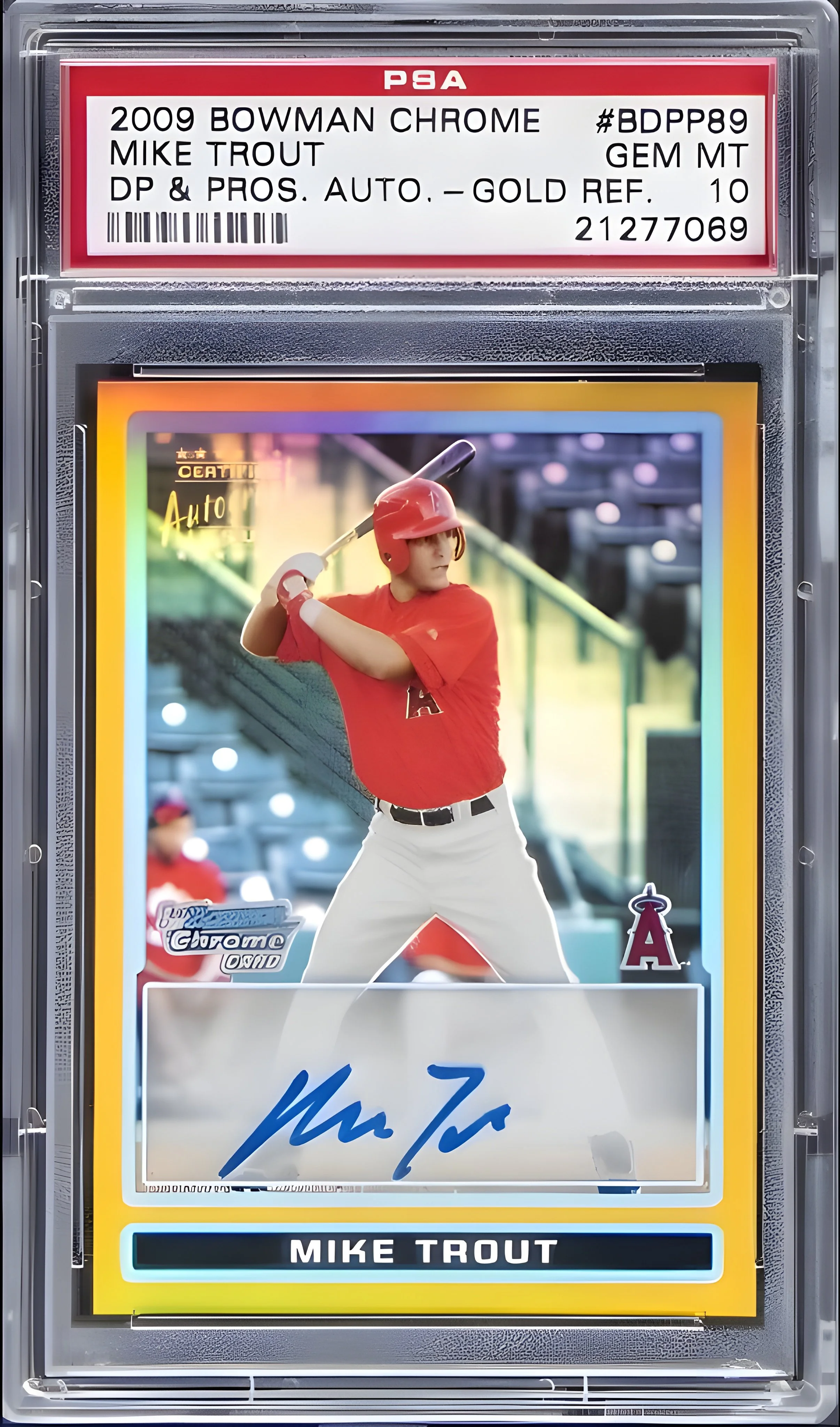 A 2009 Bowman Chrome Mike Trout baseball card featuring Mike Trout in a red uniform with a helmet, swinging a baseball bat. The card has a colorful border, a signature, and the name "Mike Trout" at the bottom.