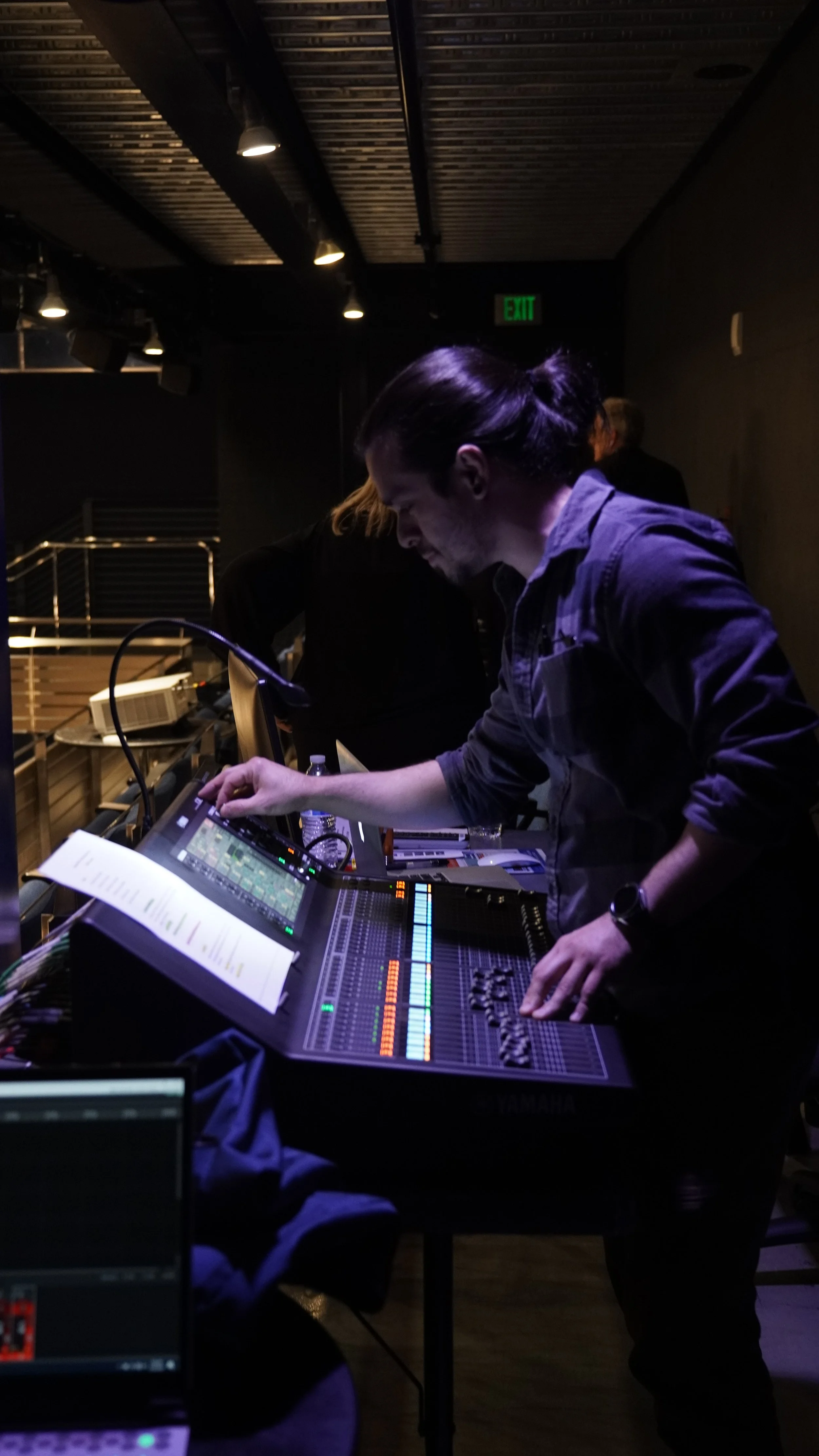 Christian Rodriguez-Ortiz, lead audio engineer and founder of Christian Sound, working at his studio desk.