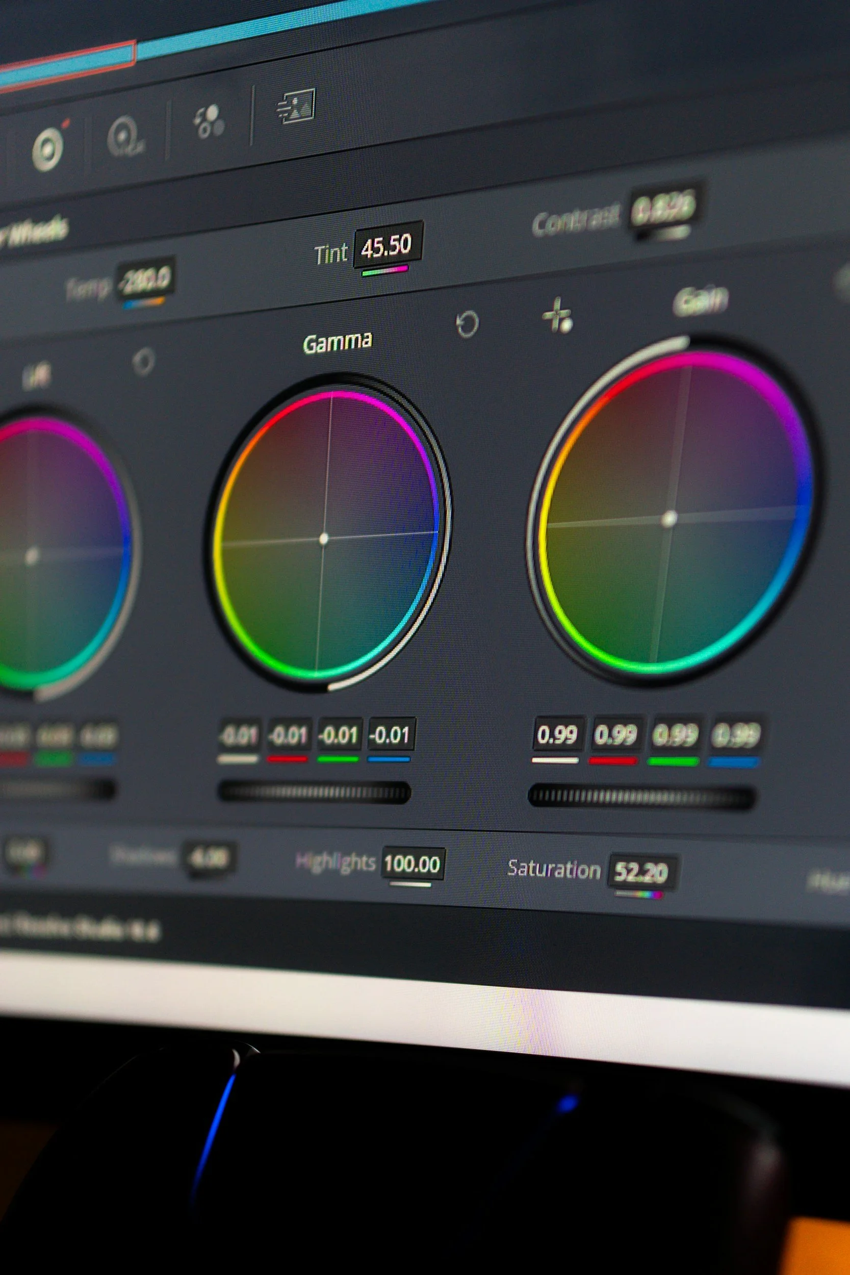 Close-up screenshot of digital photo editing software interface showing color adjustment tools, including sliders for hue, saturation, and highlights, with various dials and numerical values.