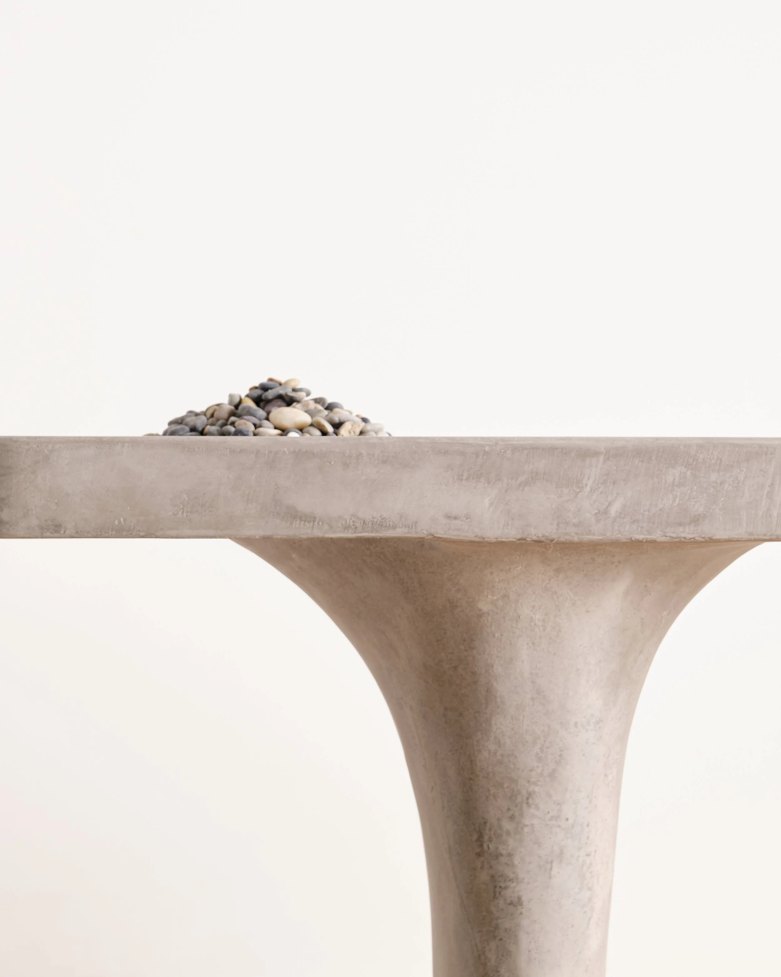 Detail of Pebbles Entry Table's hand-sculpted leg 