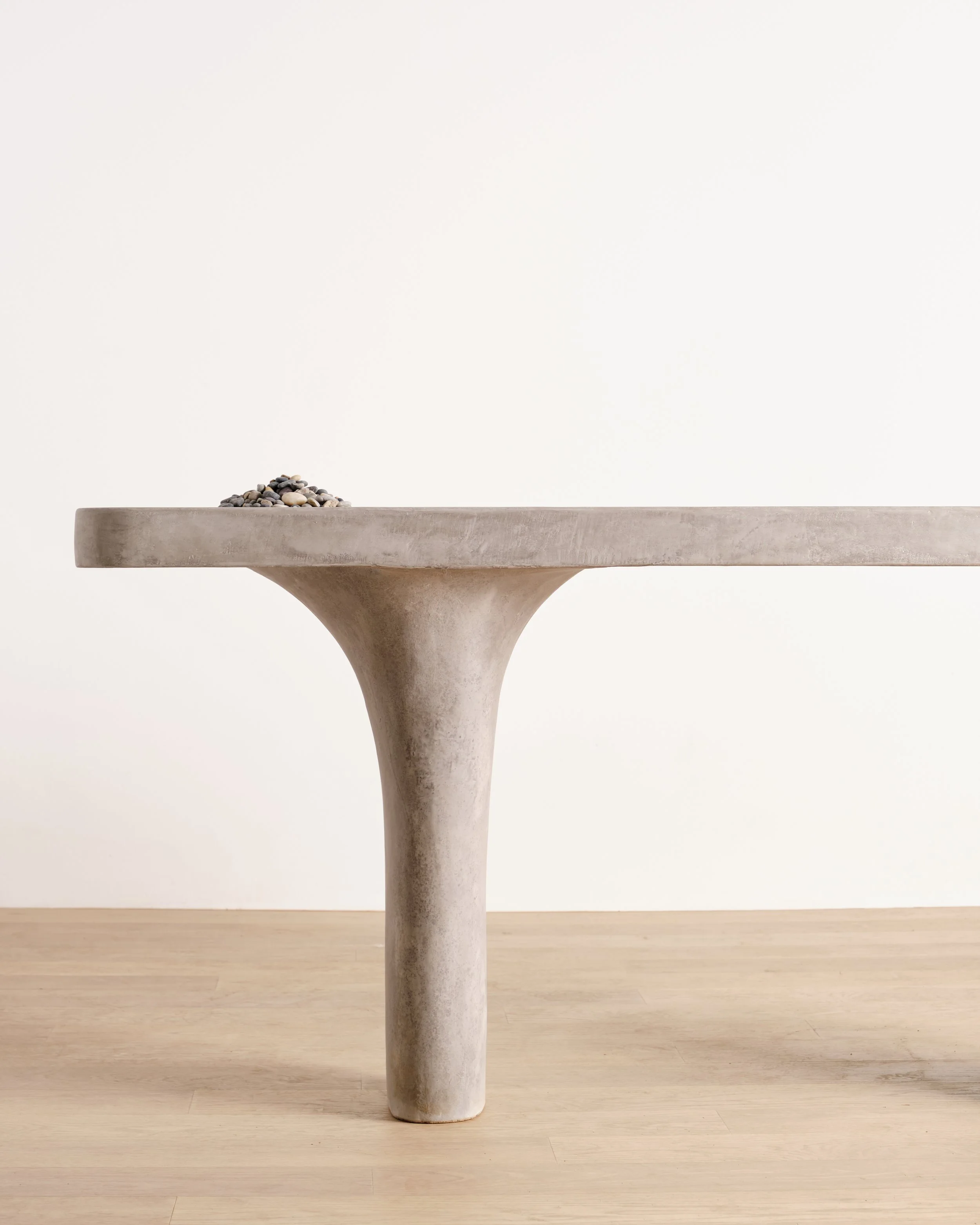 Detail of Pebbles Entry Table's hand-sculpted leg 