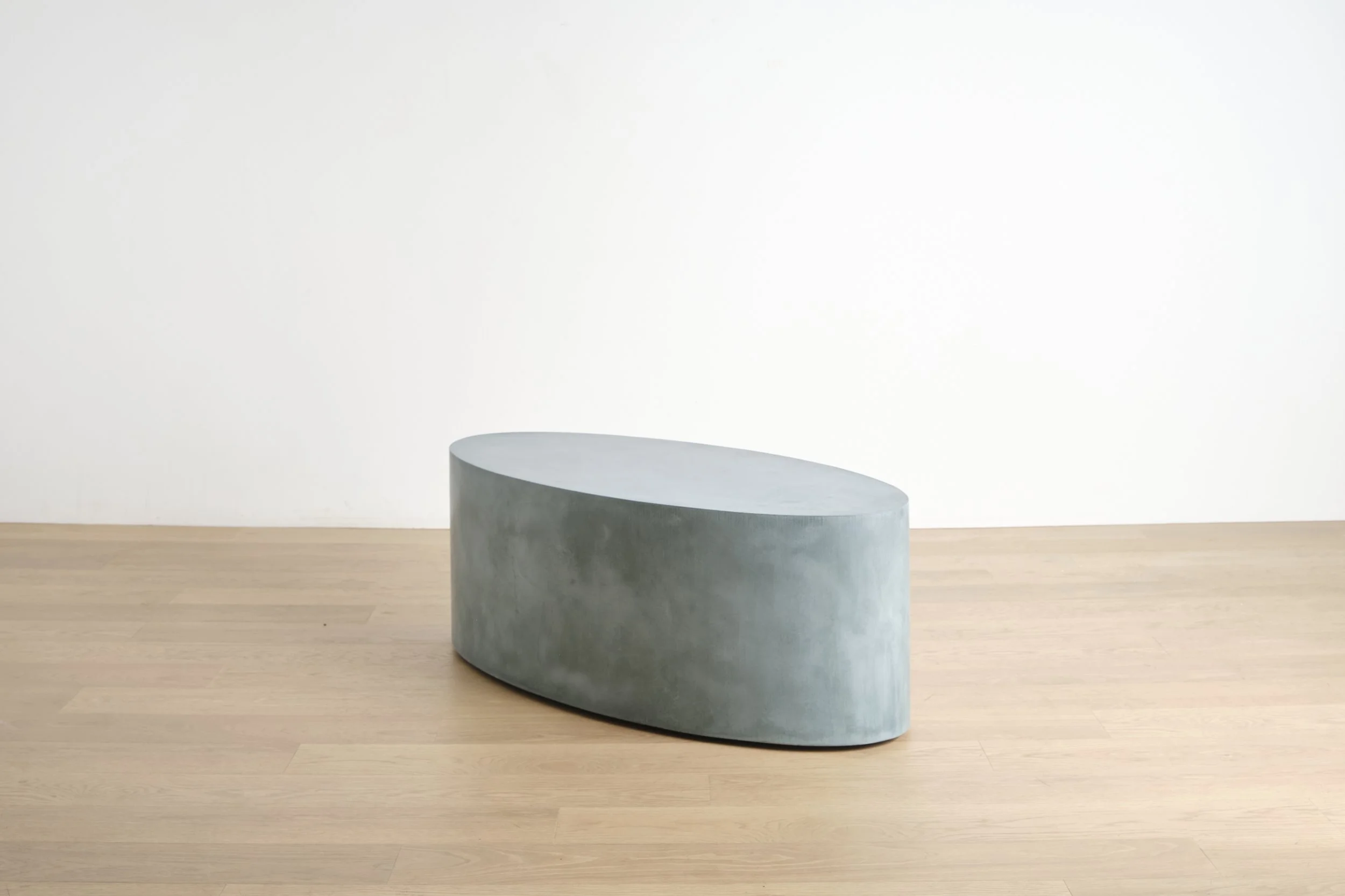 Elliptical, a mobile concrete coffee table in Teal color