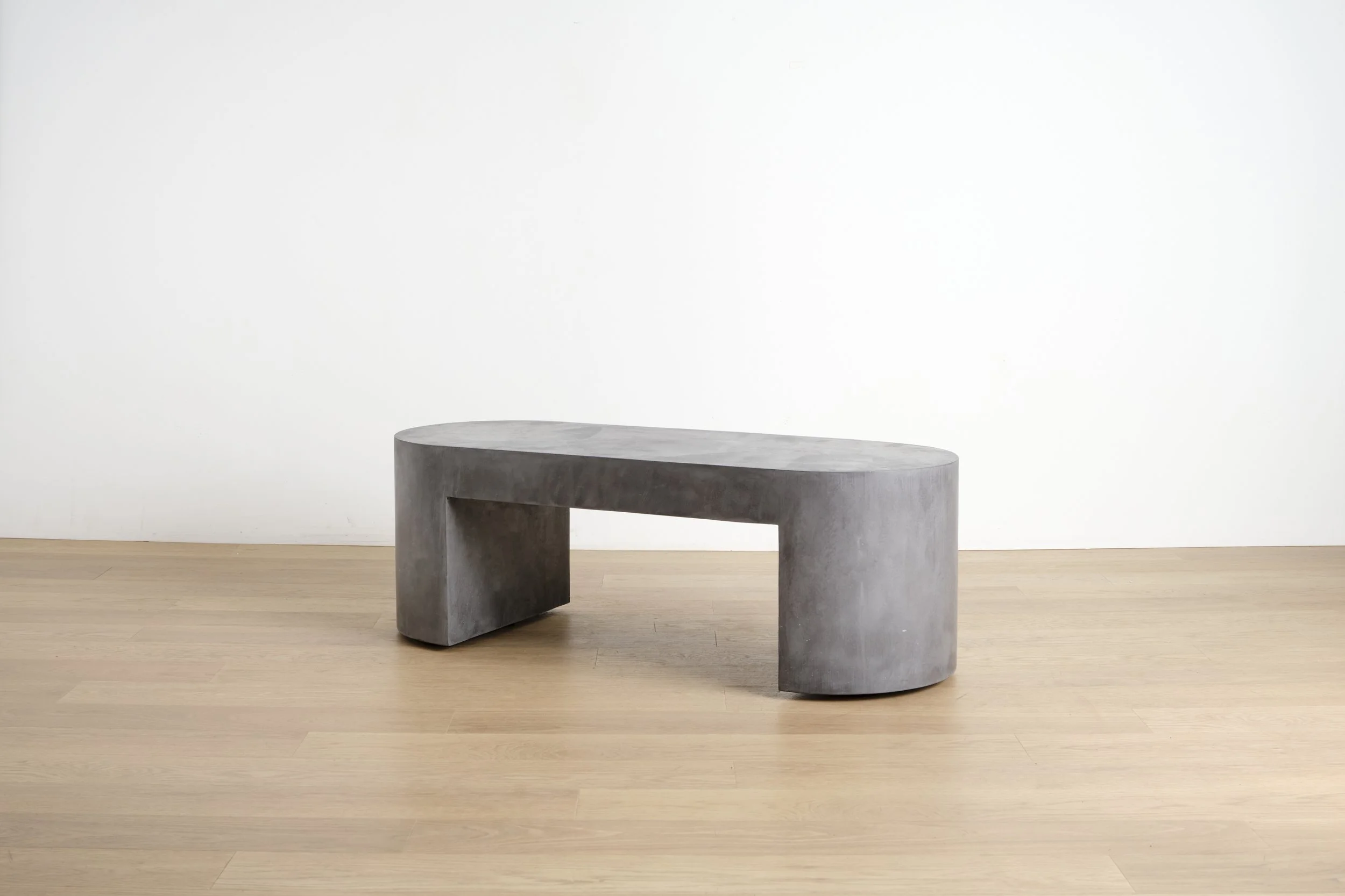 Rollerbench in Charcoal — mobile concrete bench on recessed casters, handcrafted in NYC.