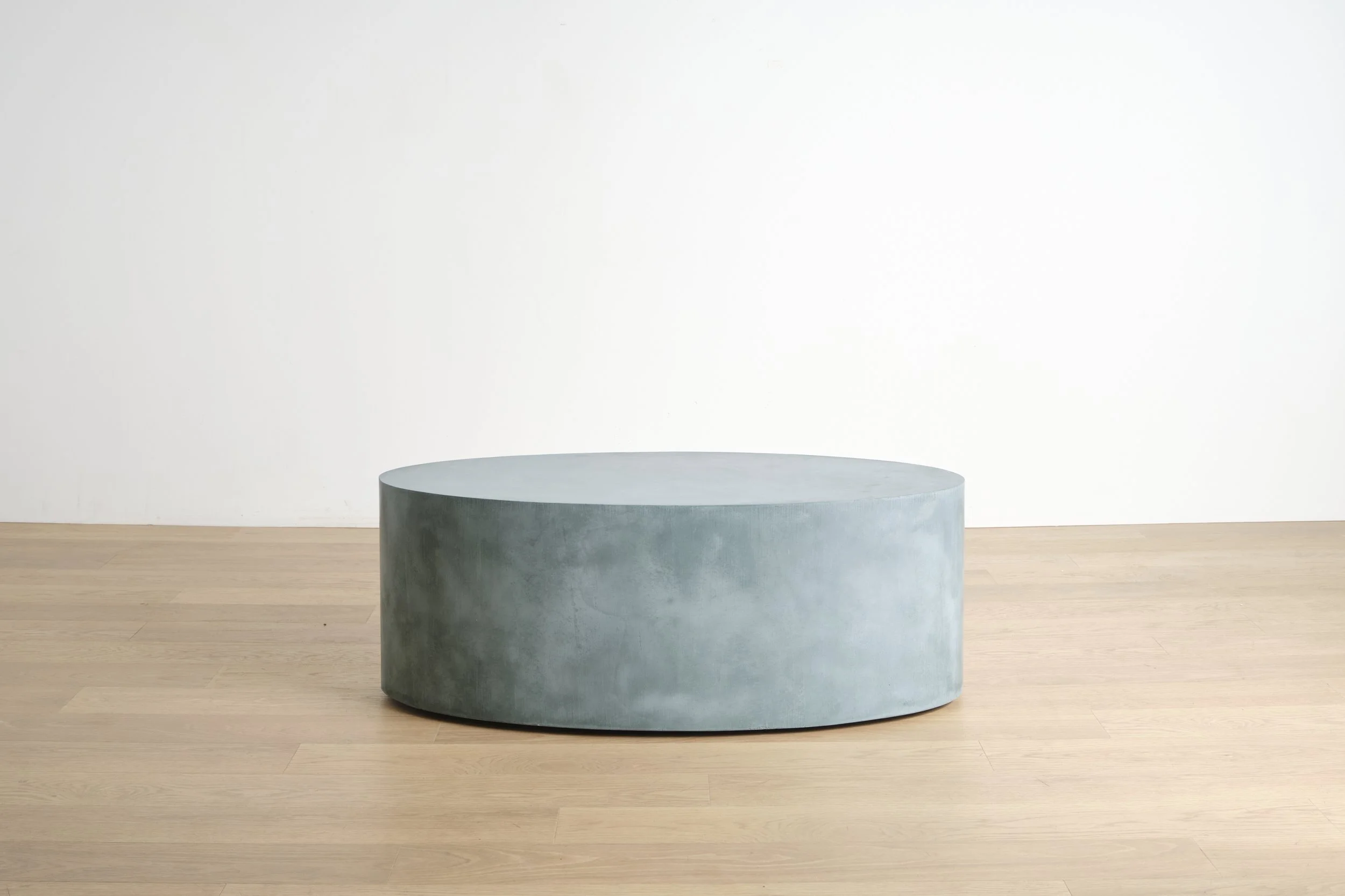 Elliptical, a mobile concrete coffee table in Teal color