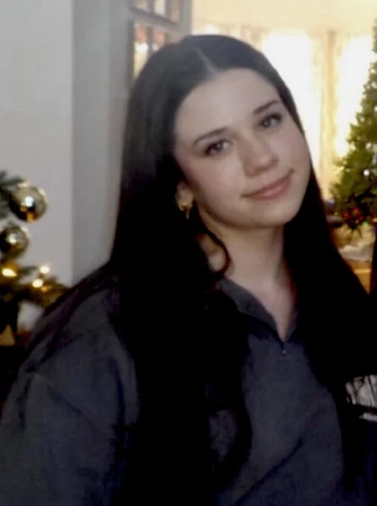 Silhouette of a child sitting on a platform pointing towards the sky with the text 'See the WORLD FOUNDATION' floating nearby.