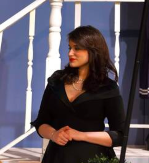 Silhouette of a person sitting on a wooden structure, pointing towards the sky, with the text "See the World Foundation" in the sky.