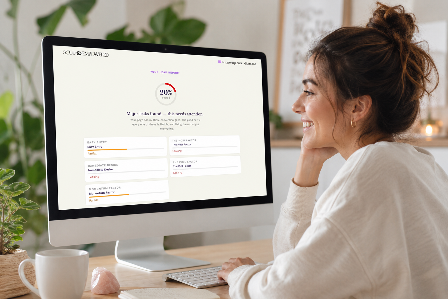 Woman on computer reviewing her sales audit