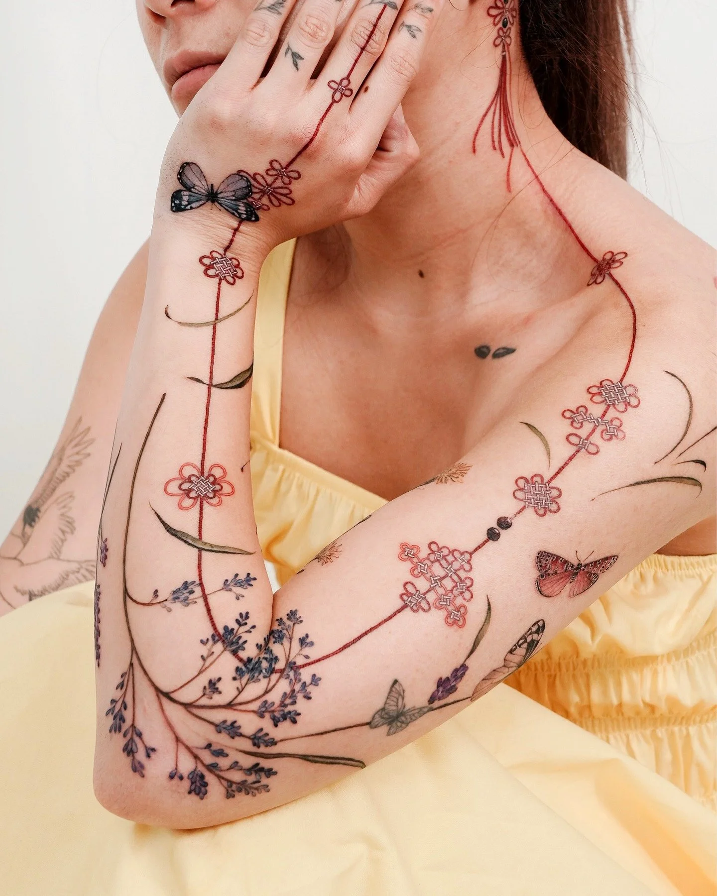 Artist Inspiration [ @tattooist_sion ] Specializing in Korean-inspired color work, Sion wraps the body in flowing red cords, cherry blossoms and traditional norigae tassels. The work stands out for its delicate palette and the way each piece drapes a
